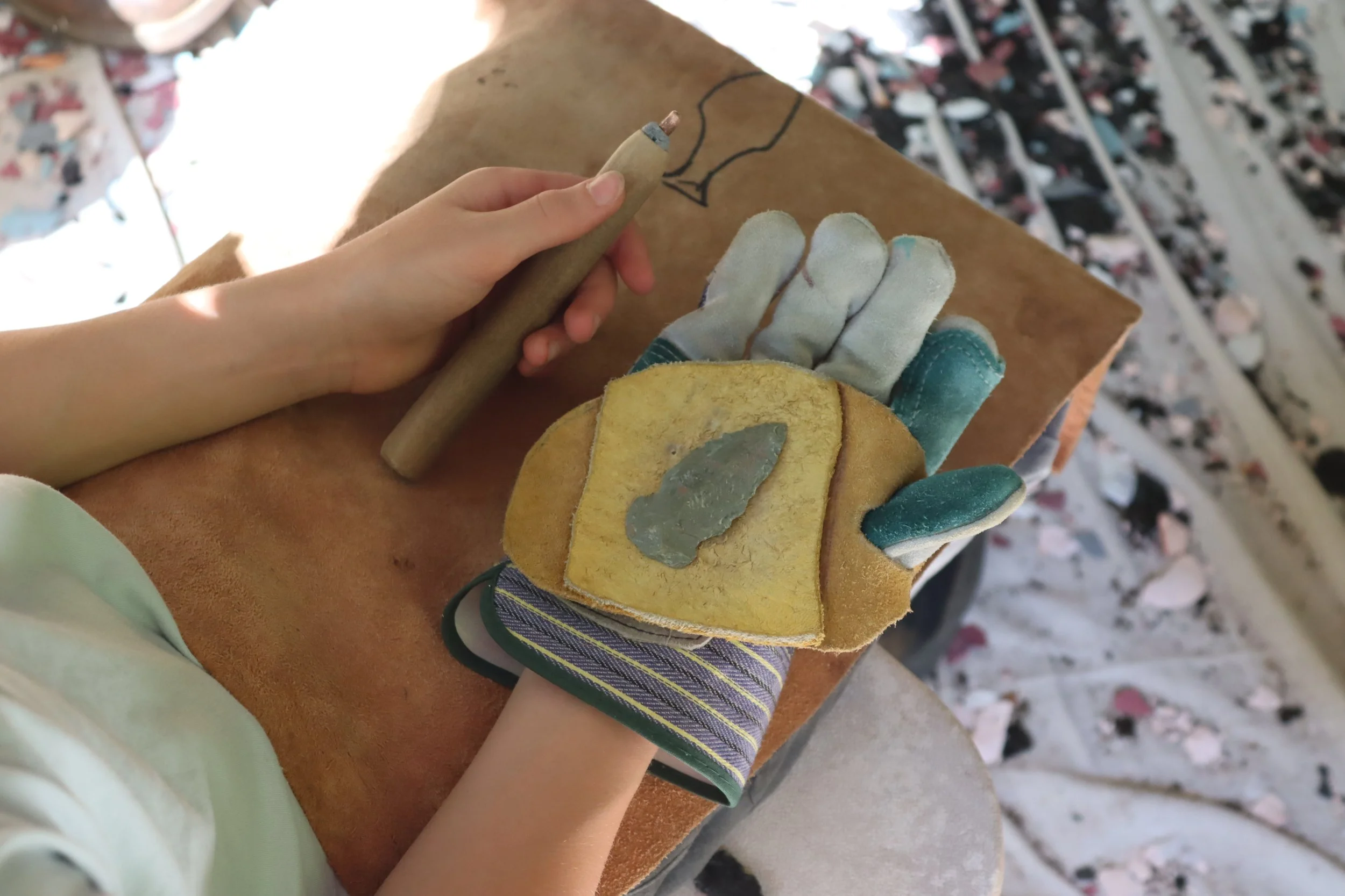 Sleepaway campers shows off his completed flint knapping project at Camp Arrowhead. 