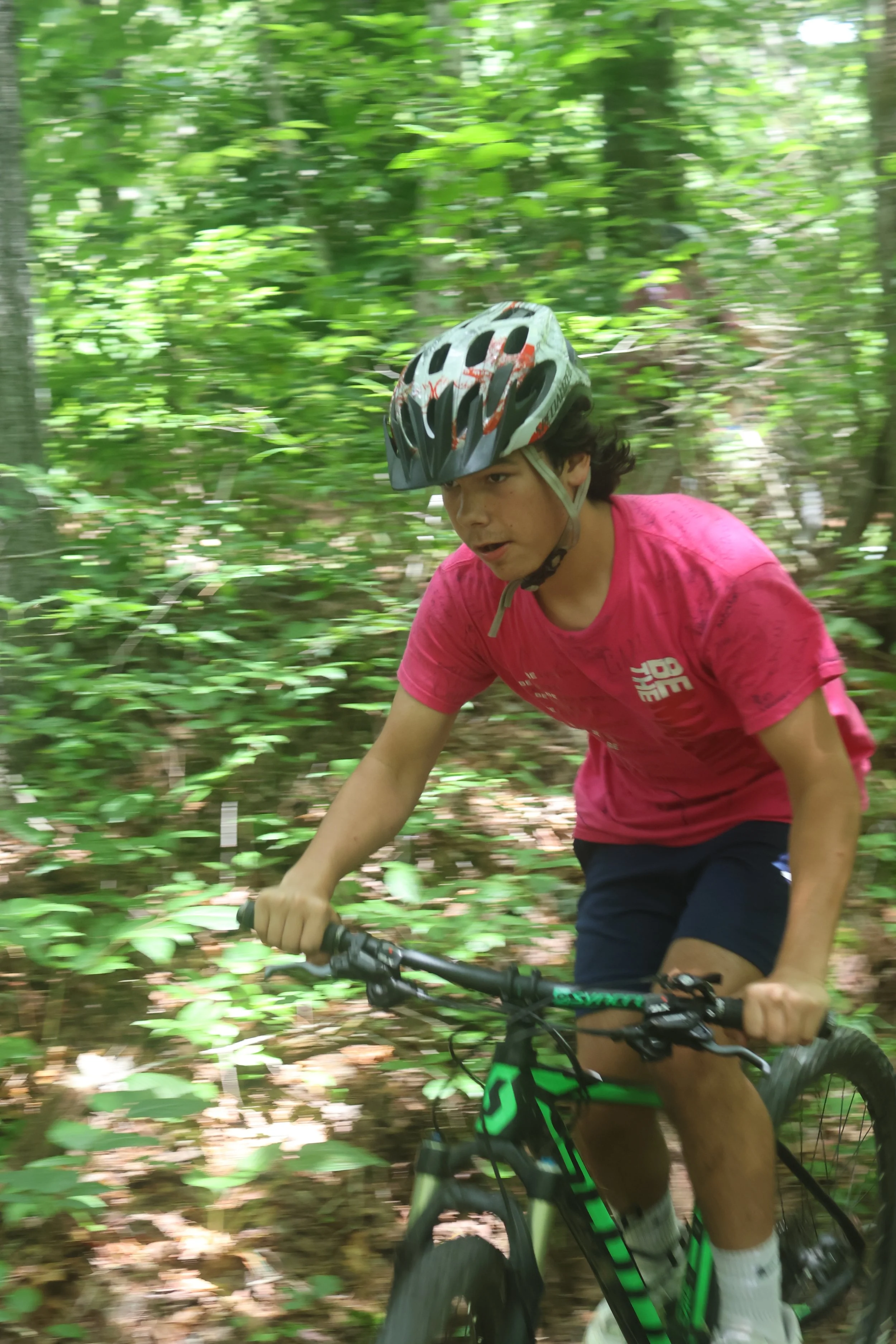 Hitting the trails, overnight campers enjoy mountain biking at camp arrowhead for boys in NC. 