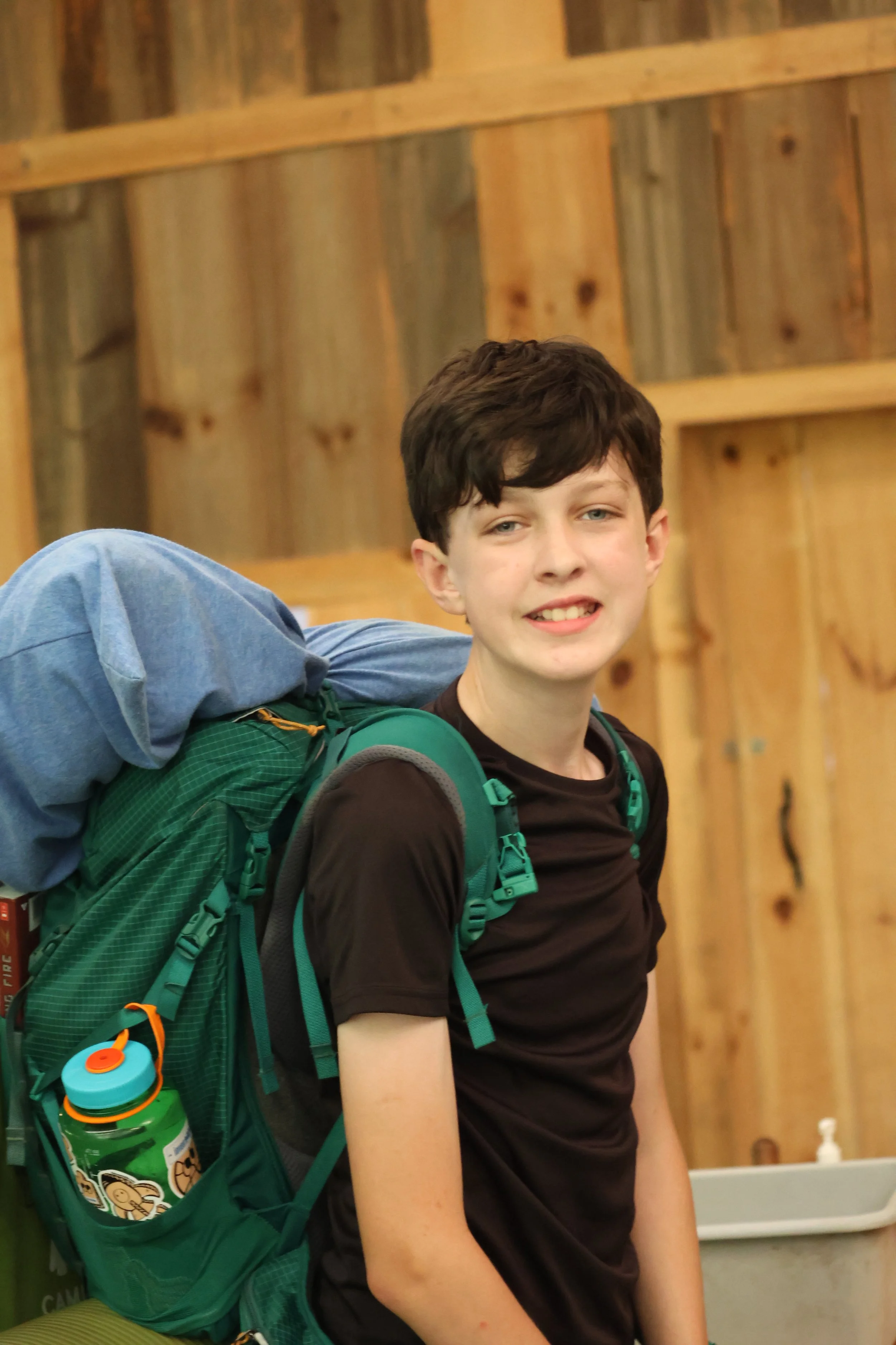 Sleepaway Camper excited for his overnight hike at Camp Arrowhead for boys in North Carolina. 