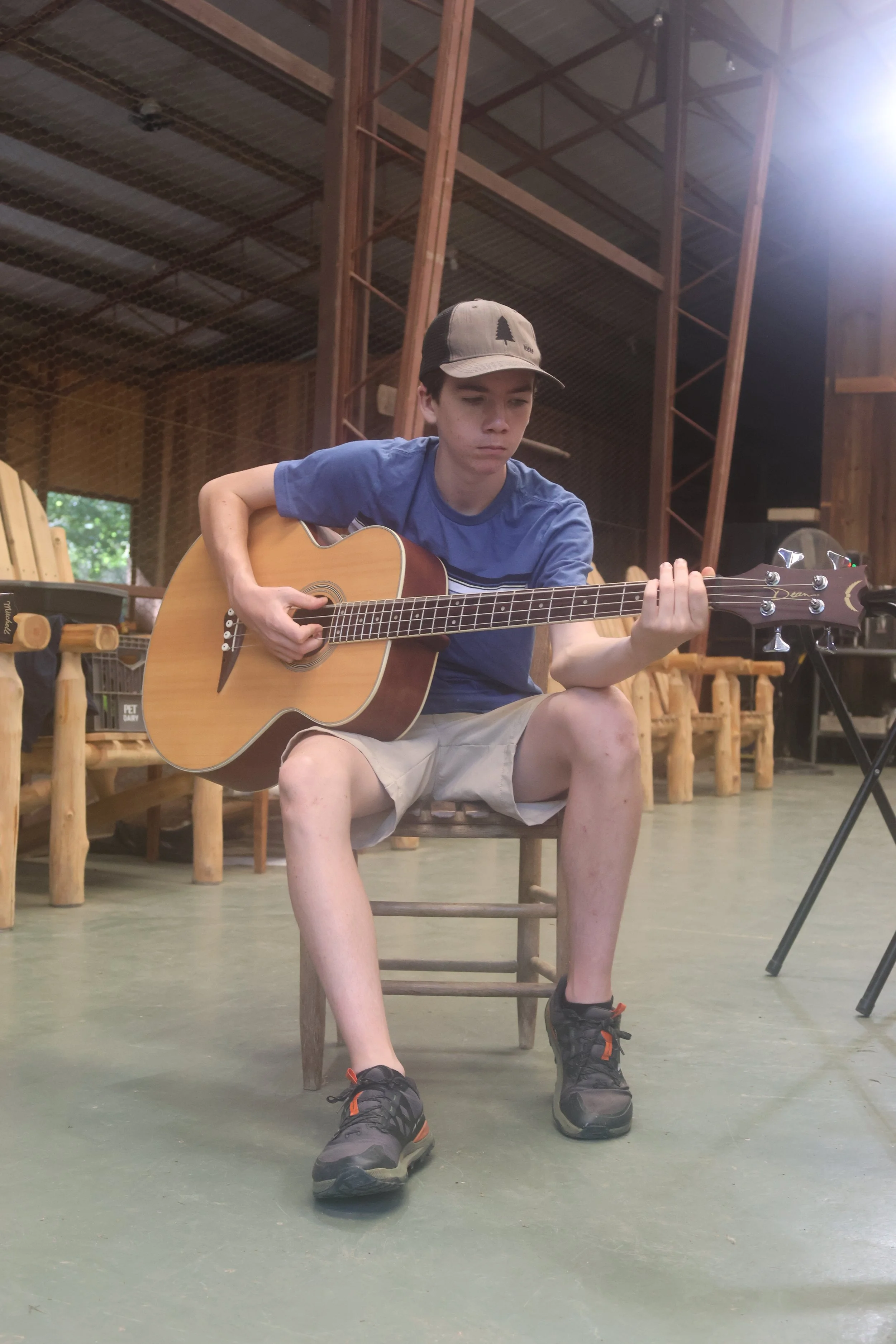 Sleepaway camper in the music choice block learning bass guitar at Camp Arrowhead in NC. 