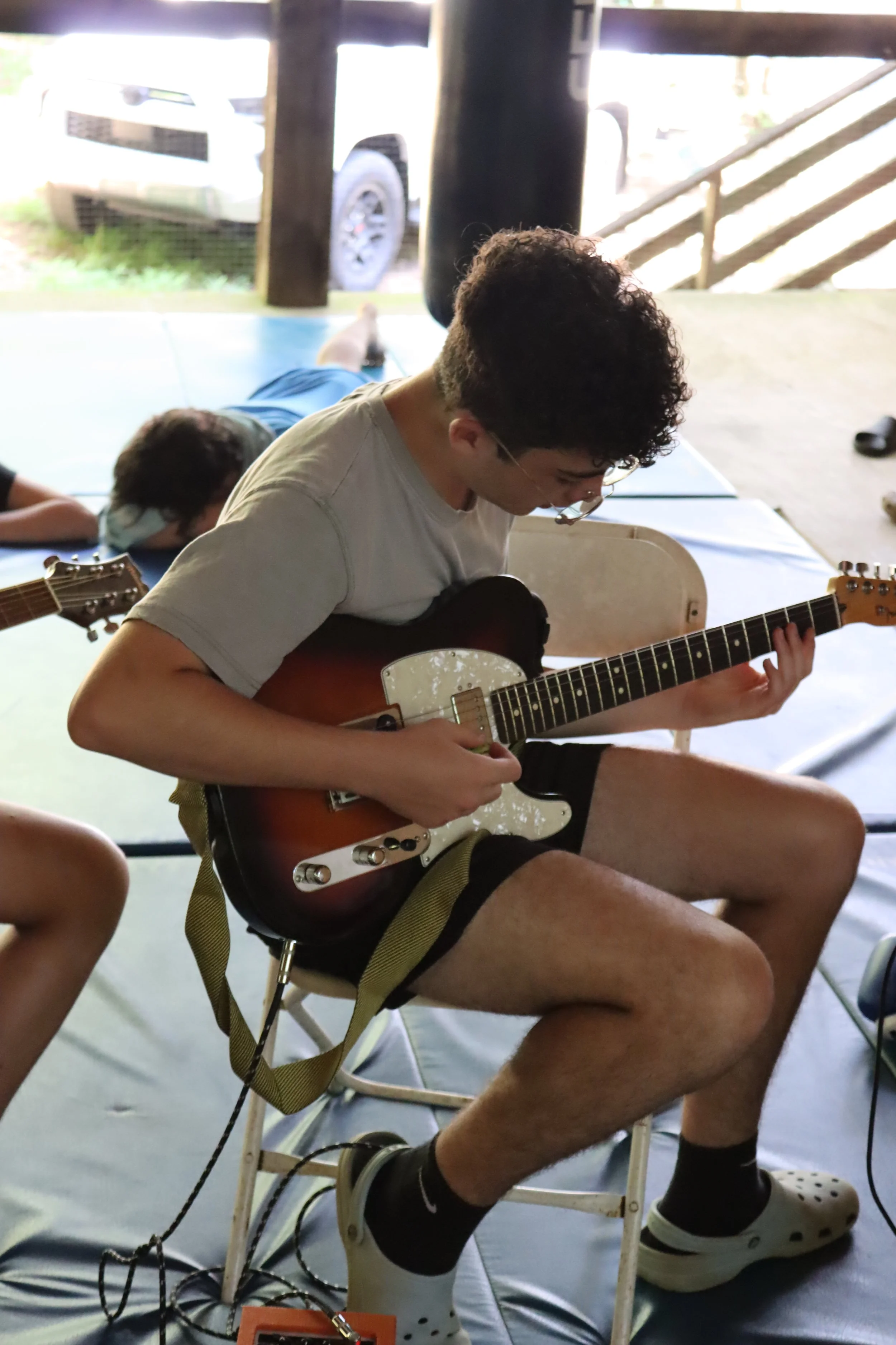 Electric guitar handled by a sleepaway camper at Camp Arrowheads music class in NC. 