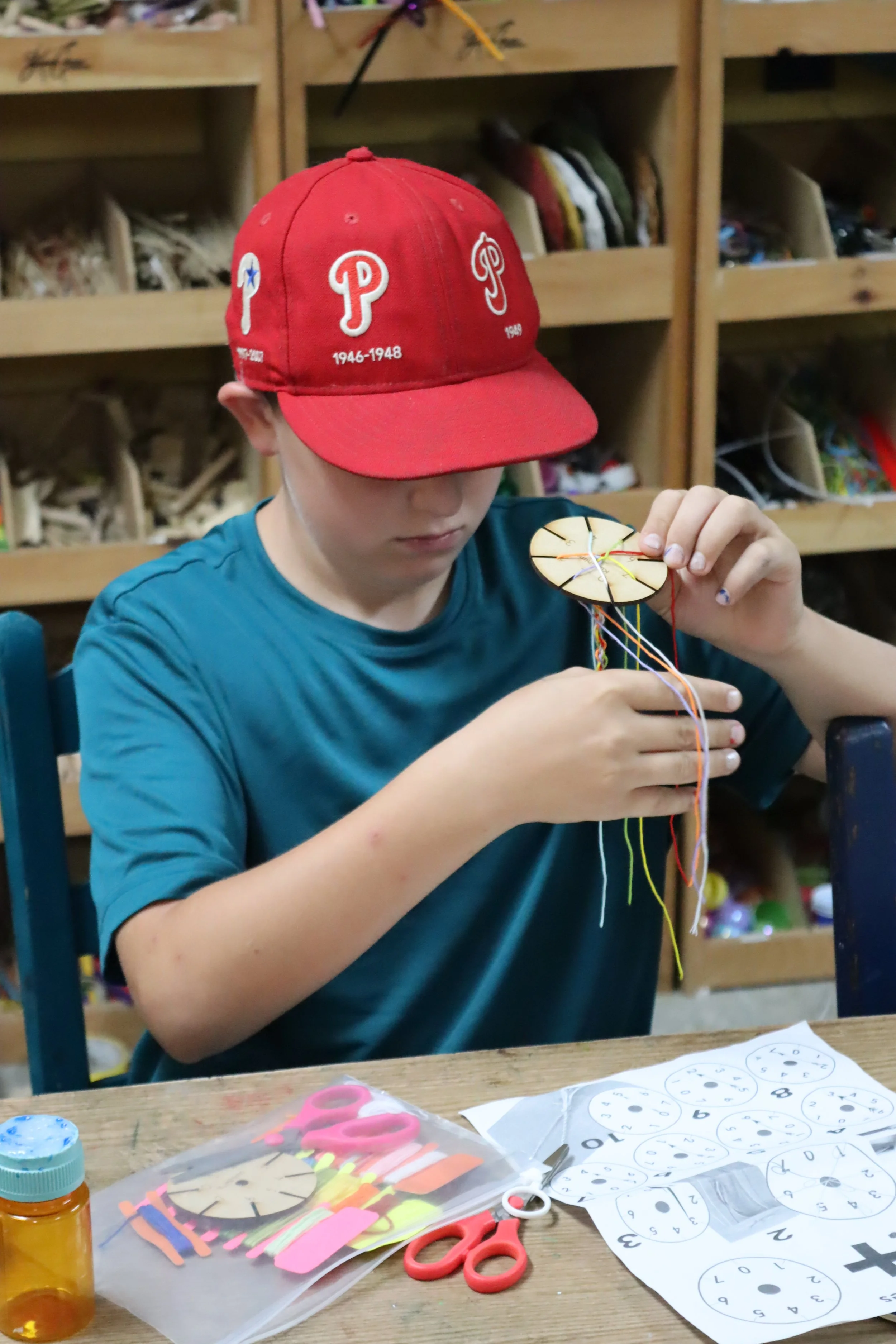 Sleepaway camper makes something at Camp Arrowhead for boys in NC. 