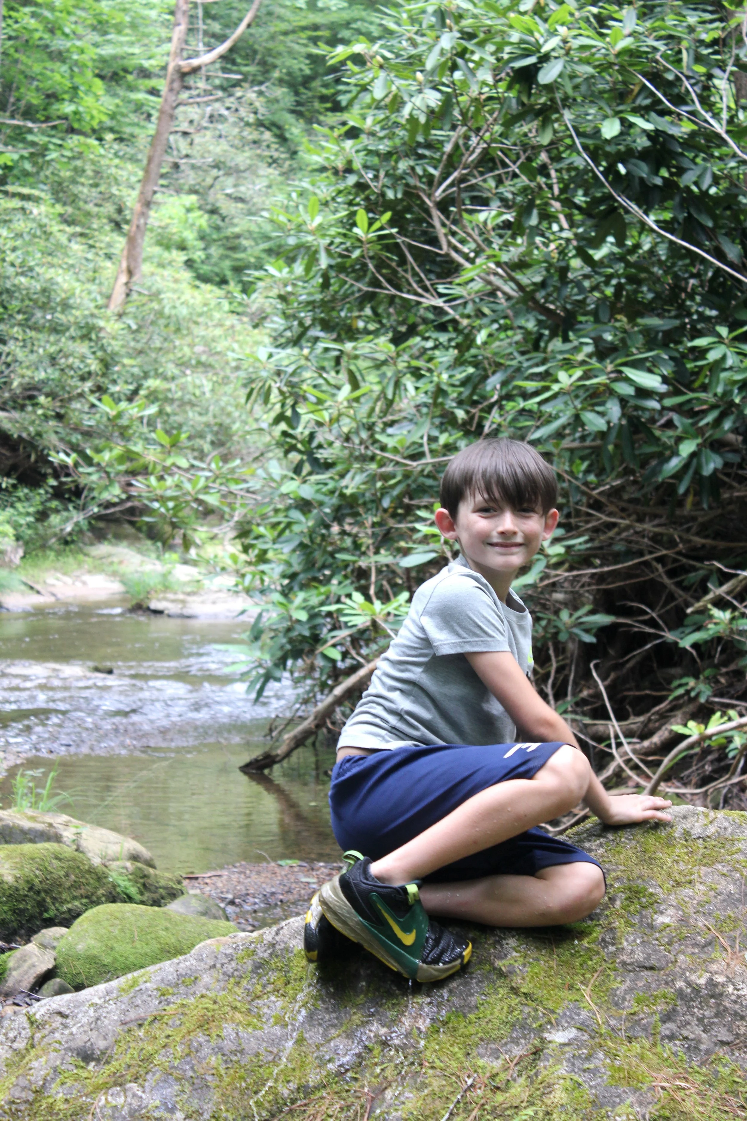 Boy on Rock in Creek 