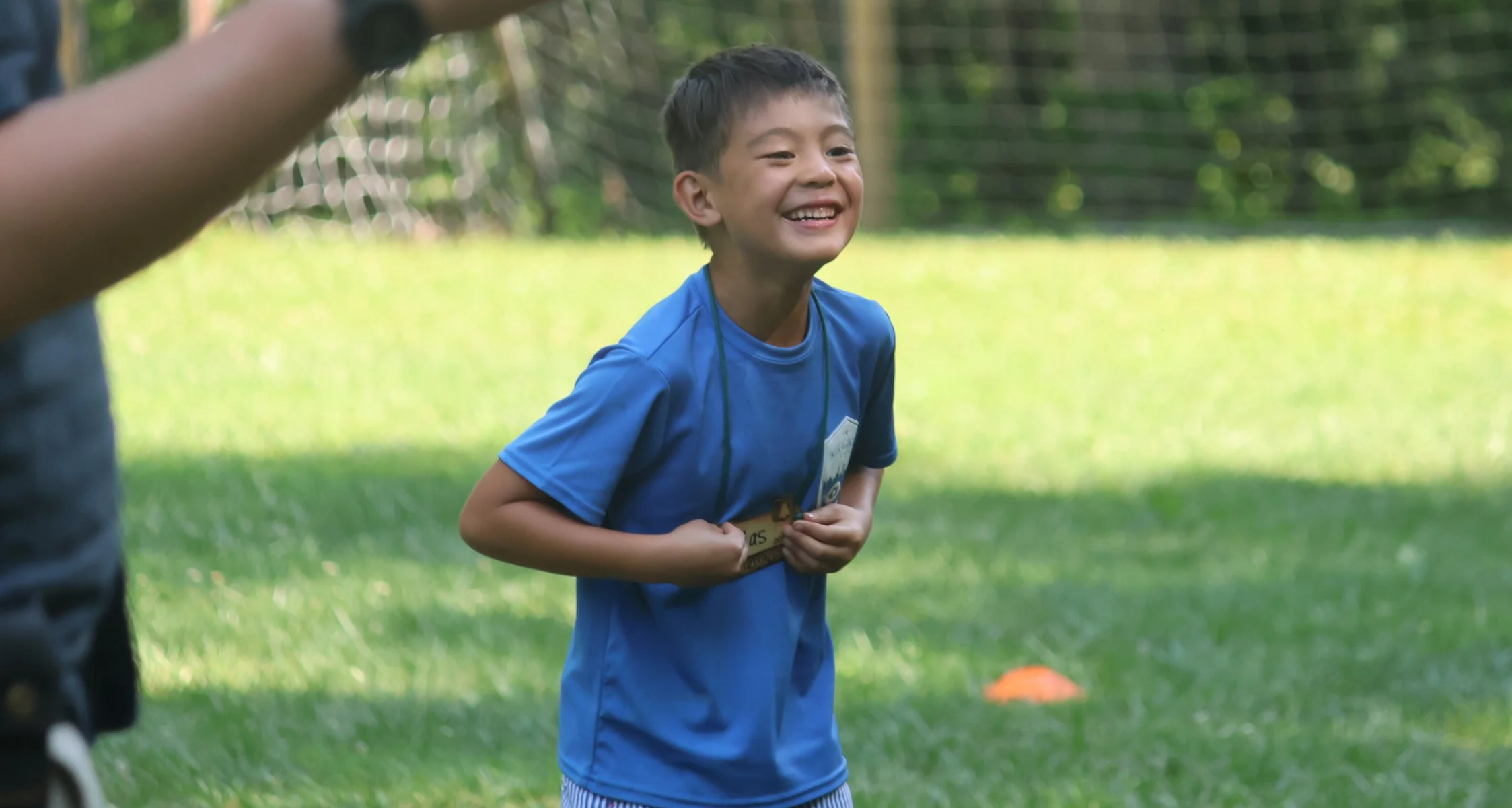 Camper having fun on the Camp Arrowhead for boys Field in North Carolina.