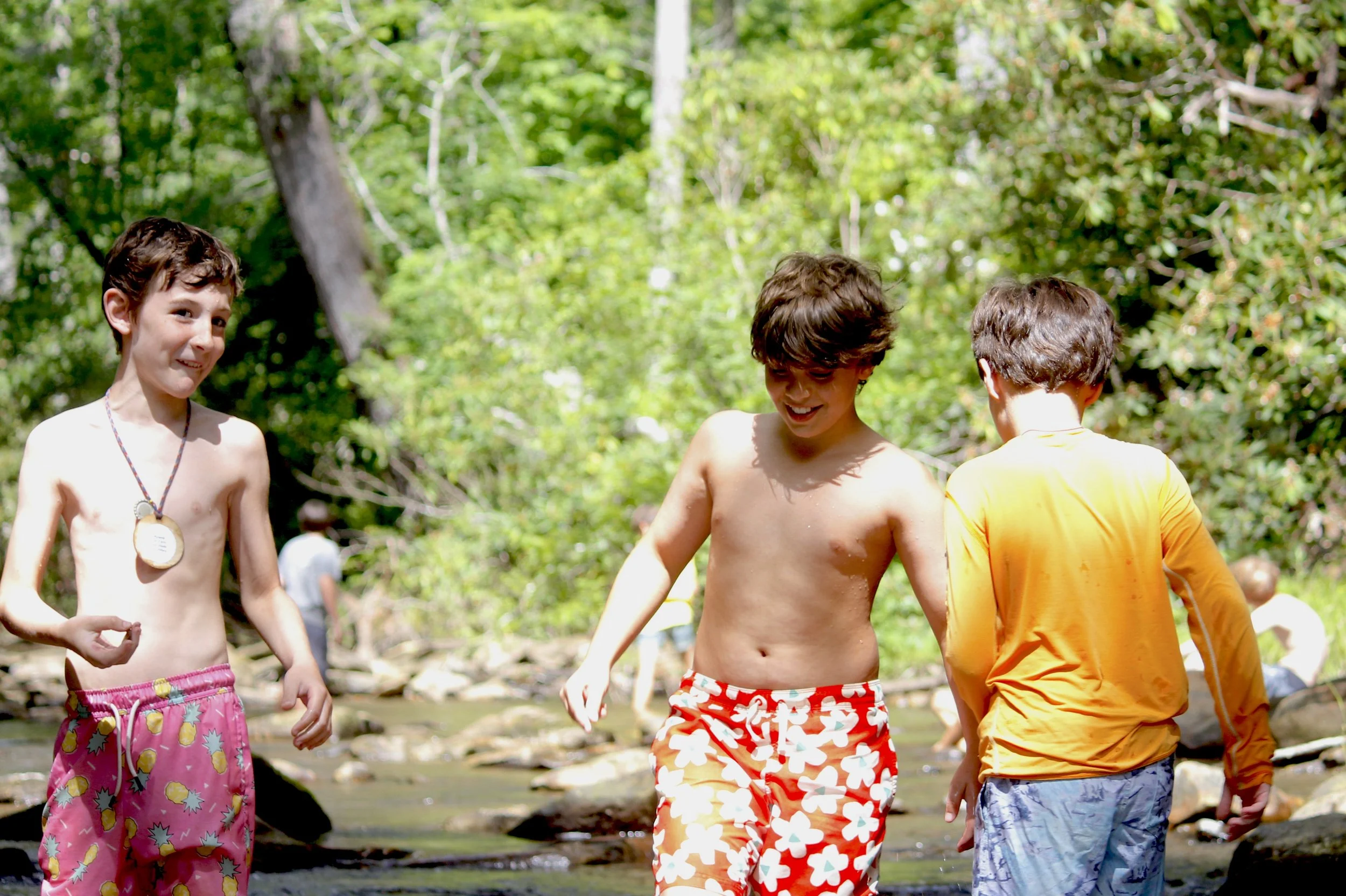 Camp Arrowhead campers have fun in the sun in the river at summer camp.