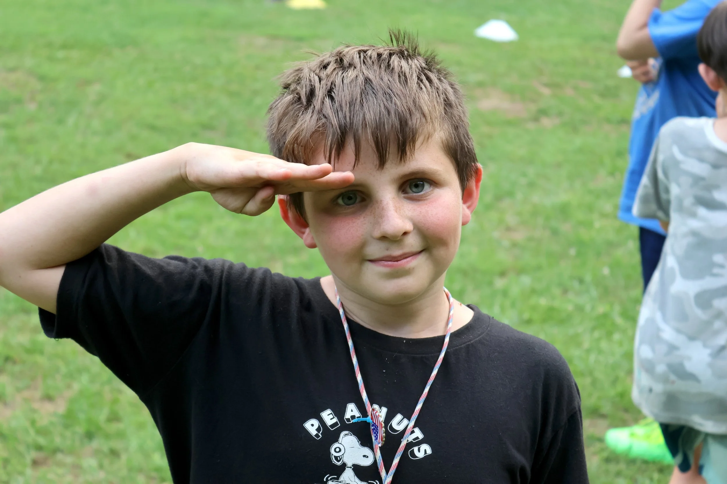 A fun and goofy boy who is having a good time At Camp Arrowhead overnight Camp.