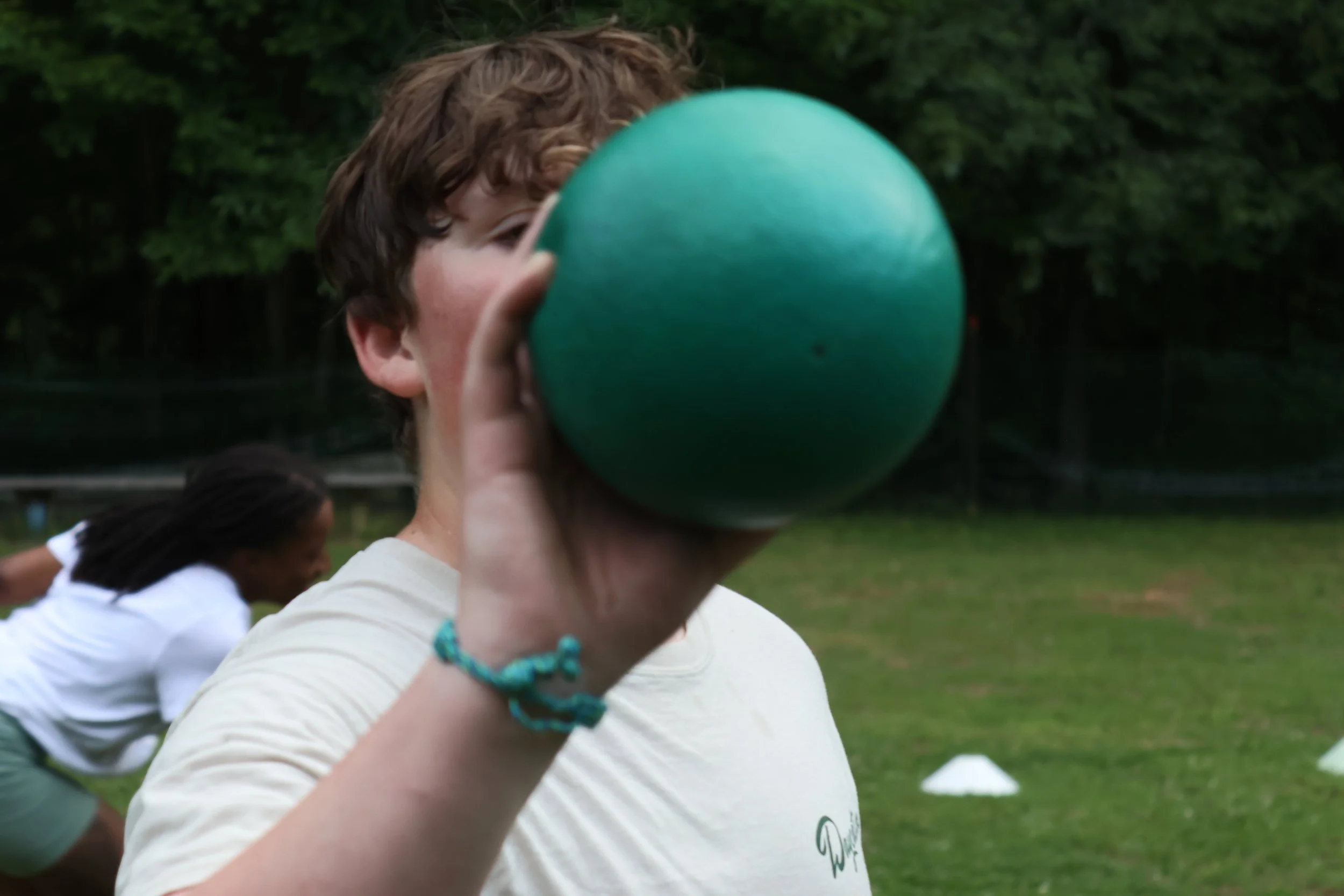 Camp Arrowhead Camper Hiding Face with a dodgeball