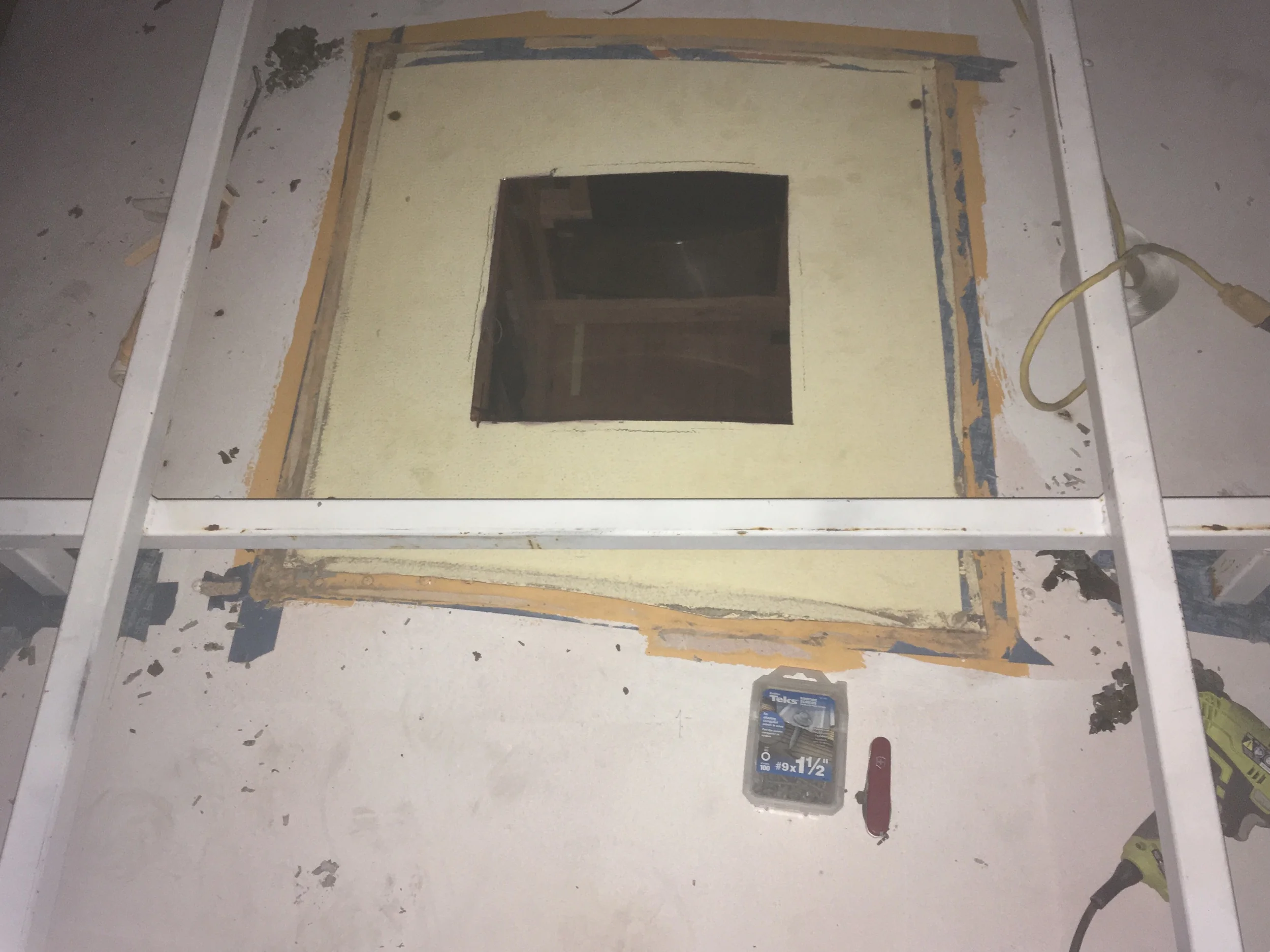 14”x14” hole cut into the ceiling. Soon to be screwed down. Butyl tape already in place below.