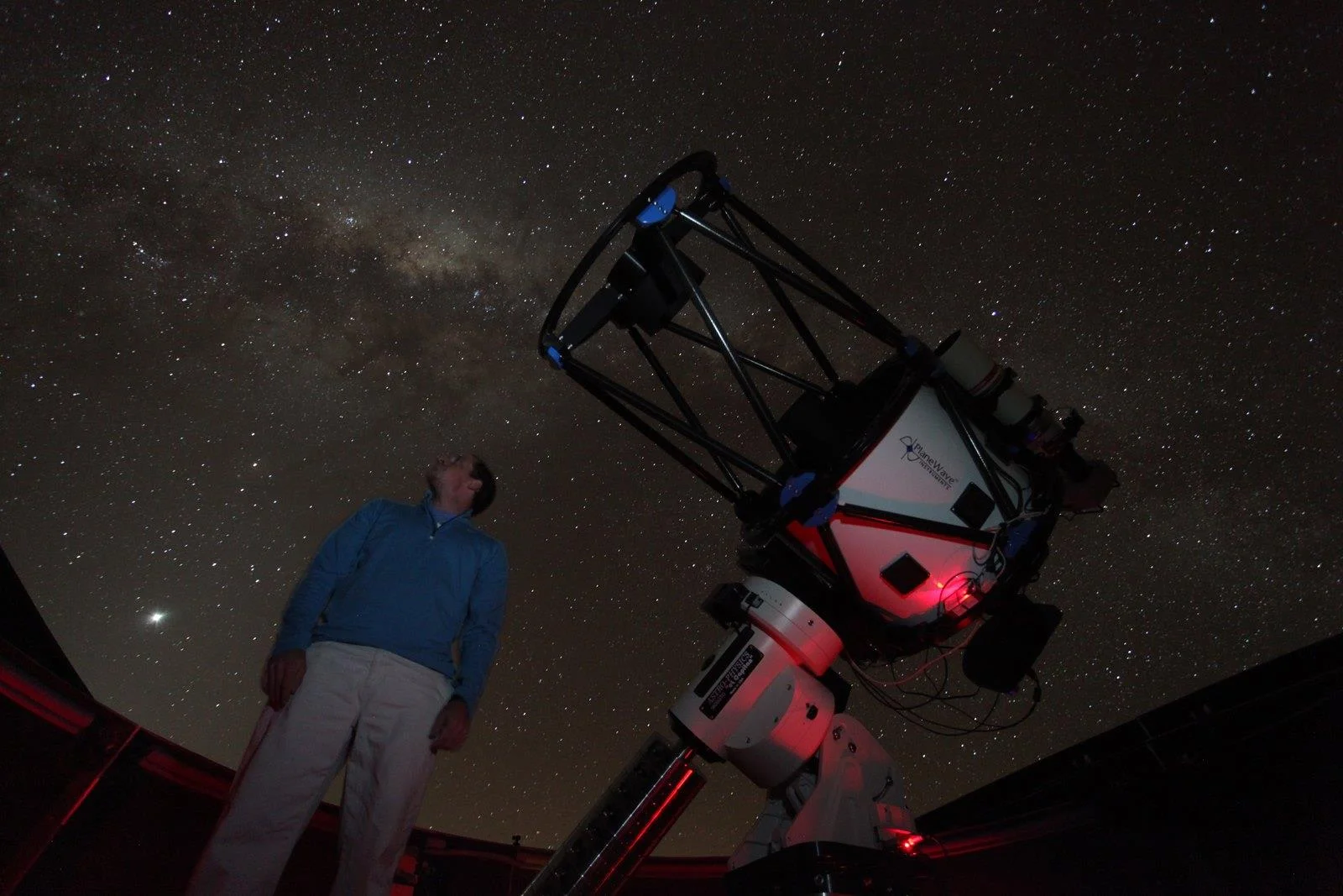 Graduate student Justin Moore and the 24-inch diameter PROMPT-8 telescope at Cerro Tololo Inter-American Observatory, Chile.