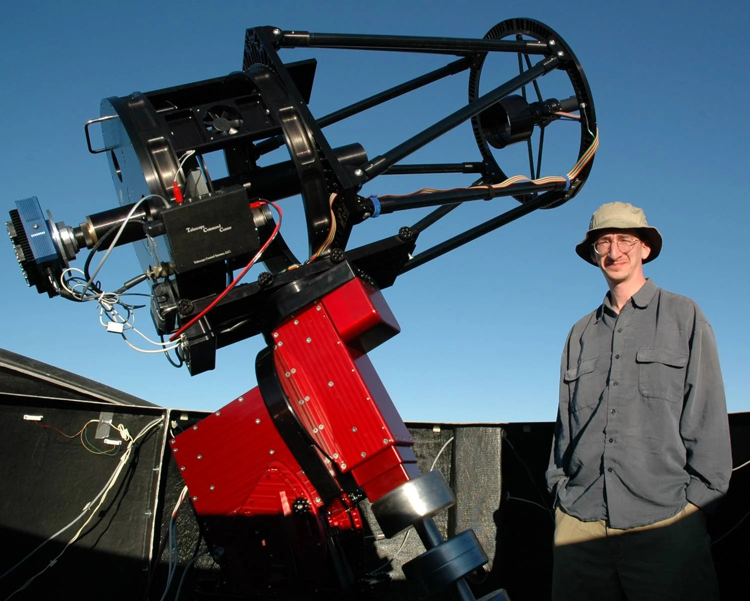Me standing next to one of our 16-inch diameter telescopes at Cerro Tololo Inter-American Observatory in the Chilean Andes. SSRO is using an identical scope, but with an upgraded, PlaneWave Instruments Ascension 200HR mount.
