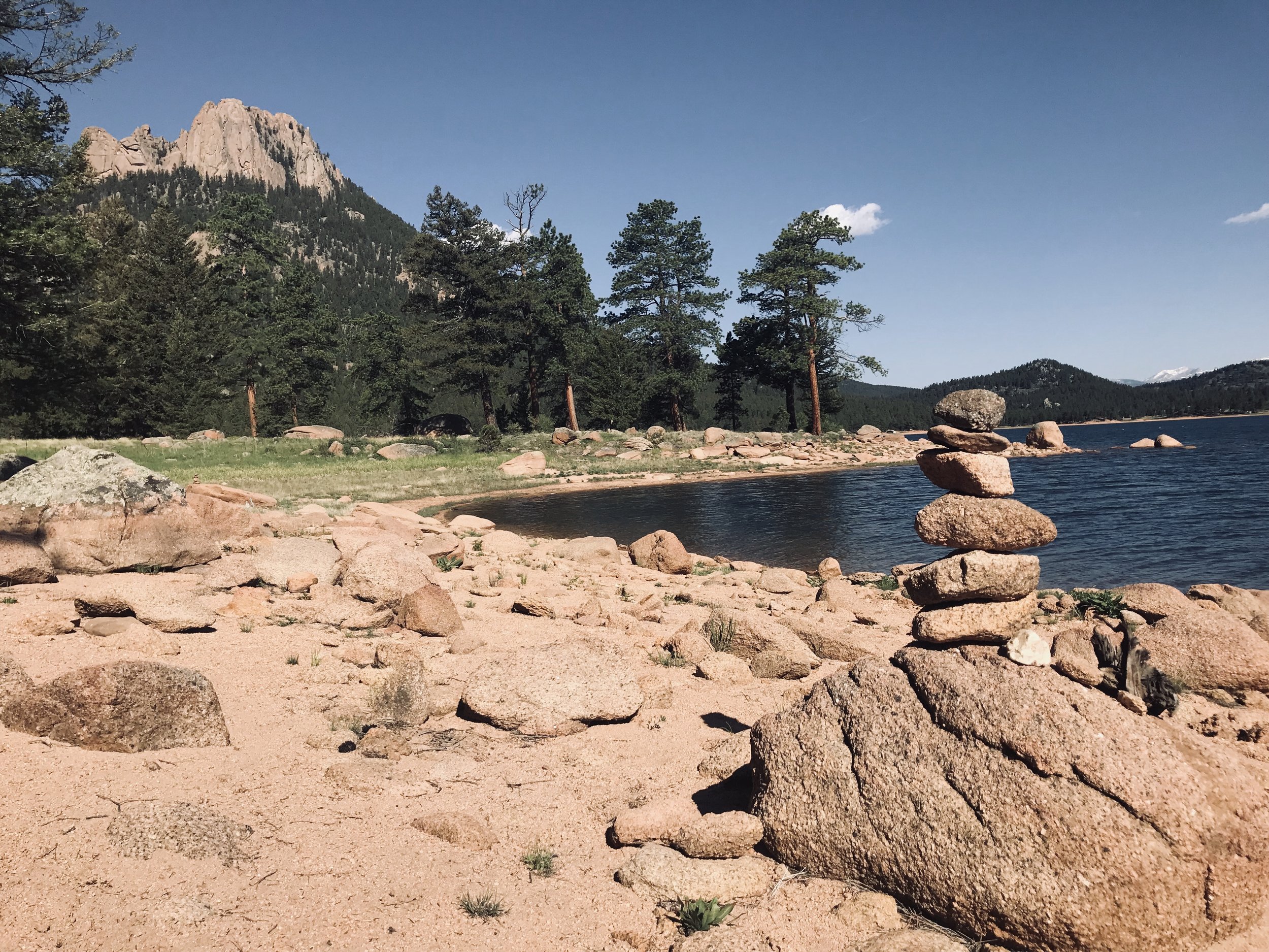 Rock cairns mark the way along the lake trail.