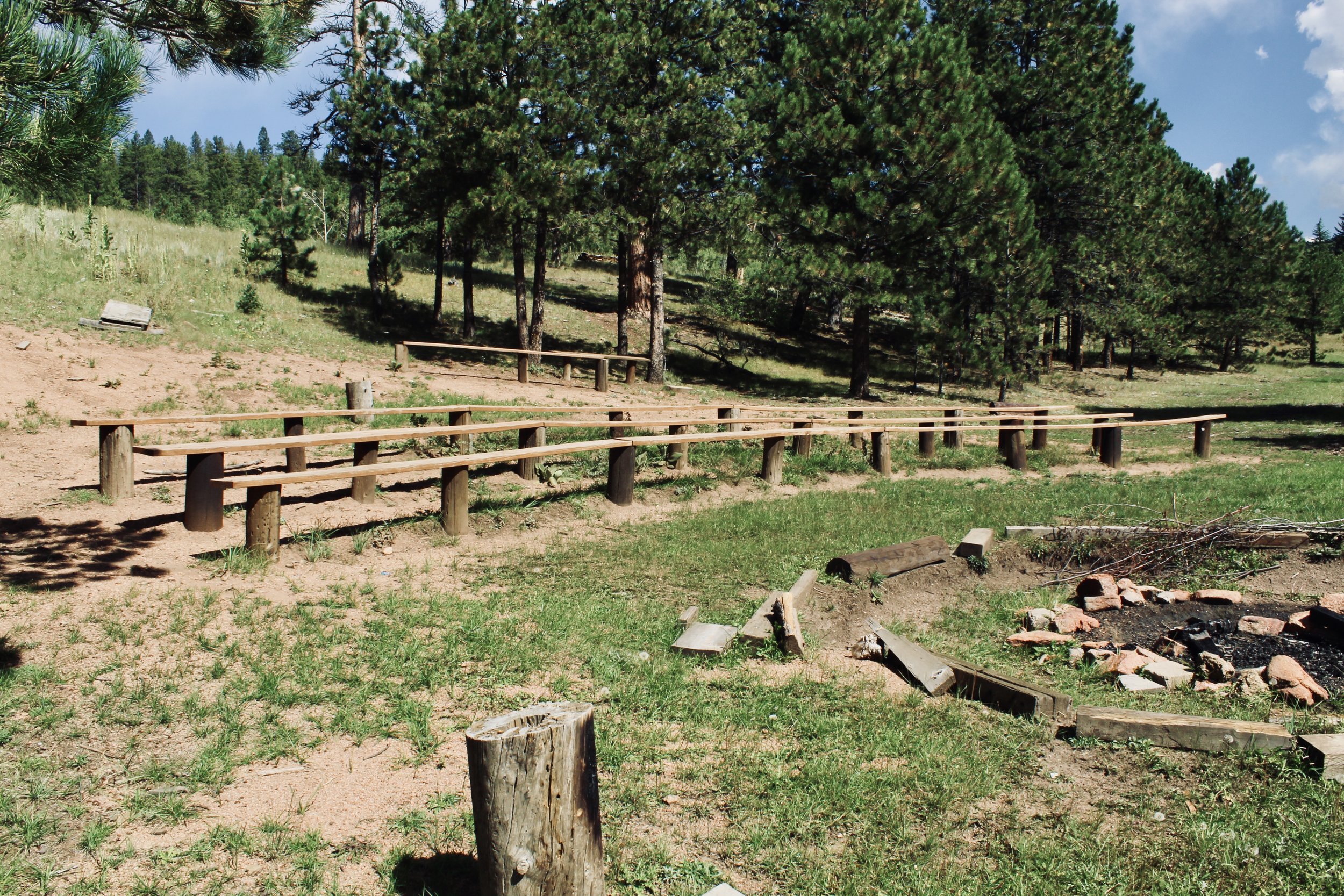 Royal Elk Meadow features a rustic fire pit and amphitheater area.