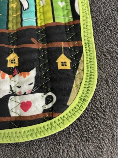 Potholder_676B_Cats on a Shelf_detail_02_21_26.jpeg