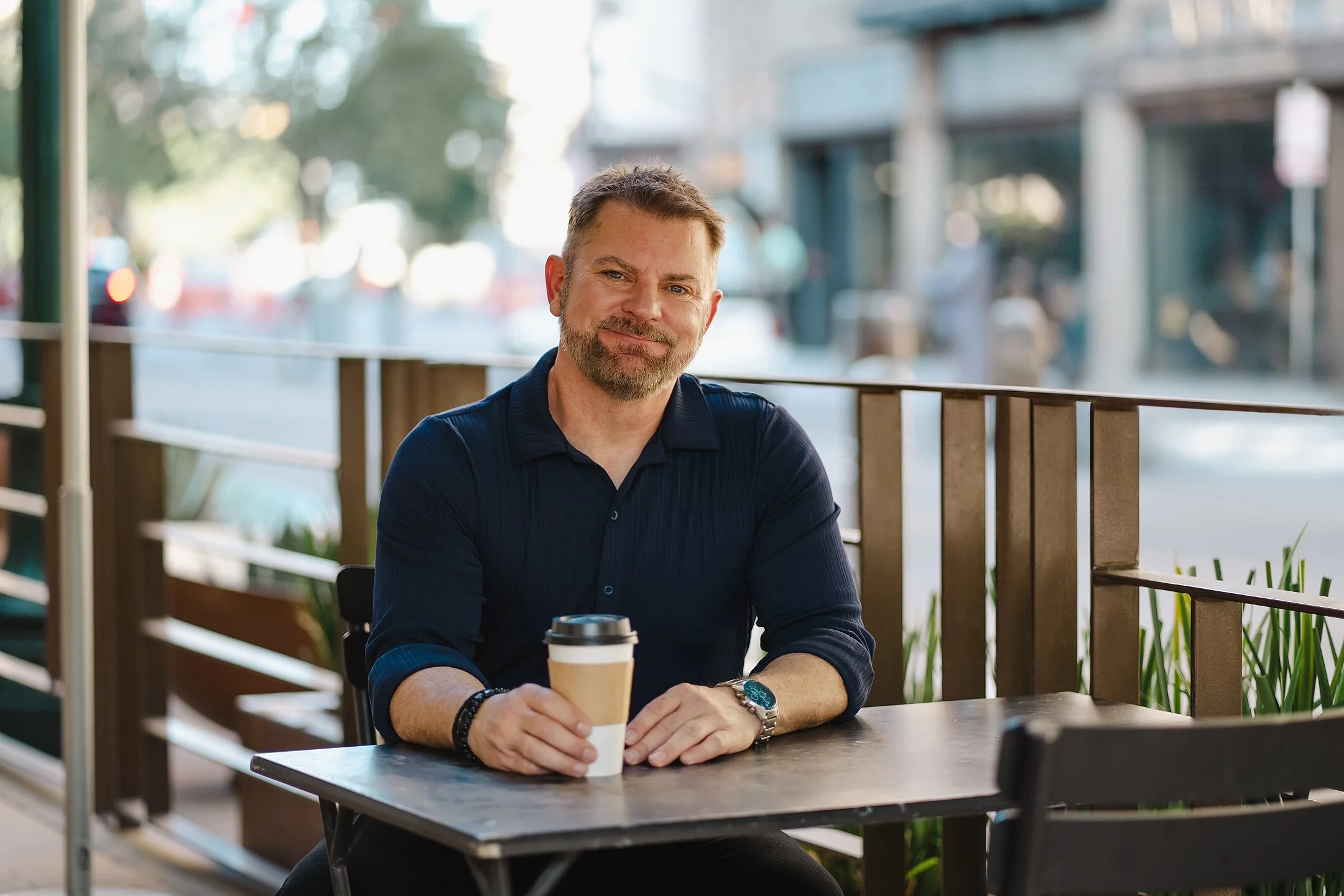 Men's business lifestyle portrait photography El Paso Texas – executive casual headshot at outdoor café by Jeanette Nevarez Photography