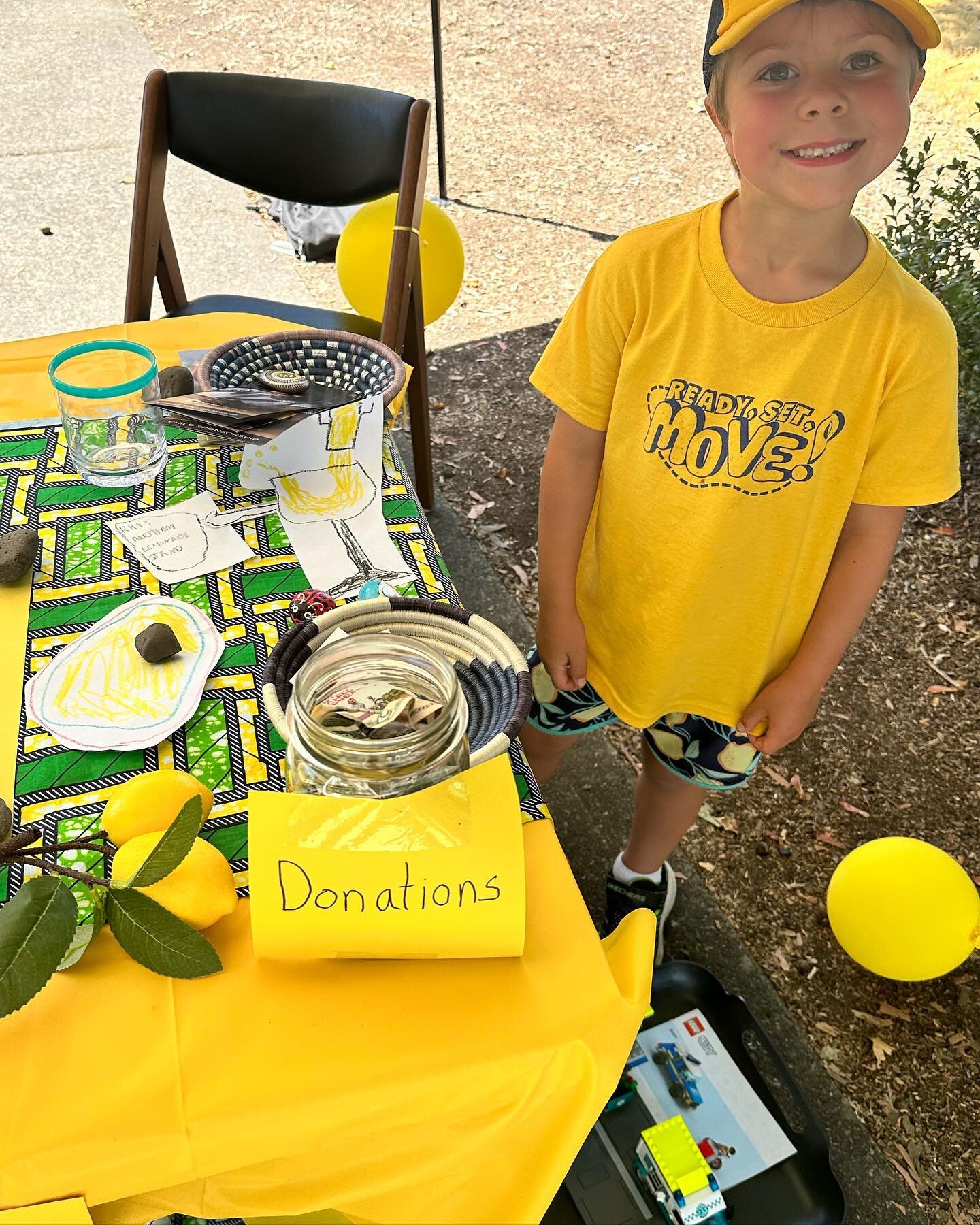 Stopped by a little neighborhood lemonade stand. 🍋 Rhys is celebrating his 6th birthday by raising money for kid&rsquo;s school lunches in Rwanda! He decorated the table, made all the signs, got the lemonade ready, and even wore matching lemon short