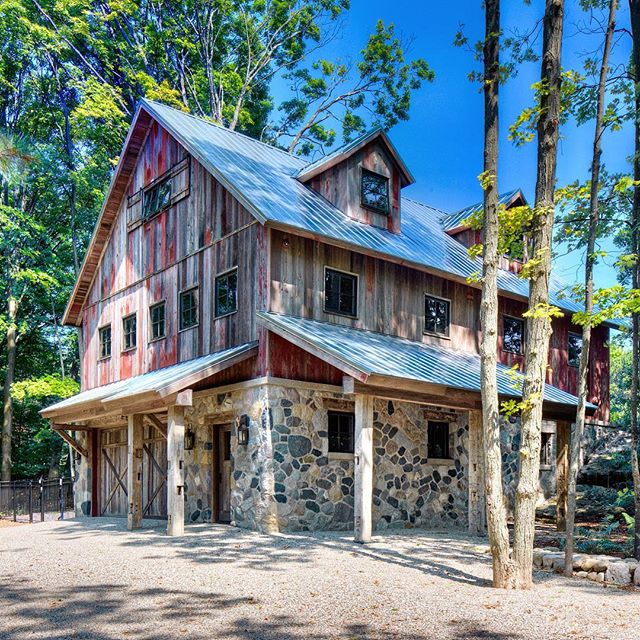 Country Barn Addition with full living-quarters equipped with a kitchen, bathroom, entertainment center, bar, gaming-tables, and room for twelve guests #northernmichiganliving #upnorthlife #barn #renovation #homeaddition