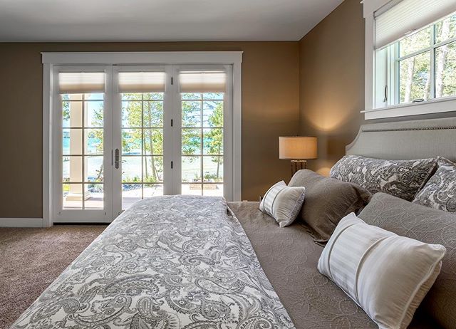 A water-front master bedroom with endless views of breathtaking Lake Michigan. #viewsfordays #masterbedroom #interiordesign #lakeside #puremichigan