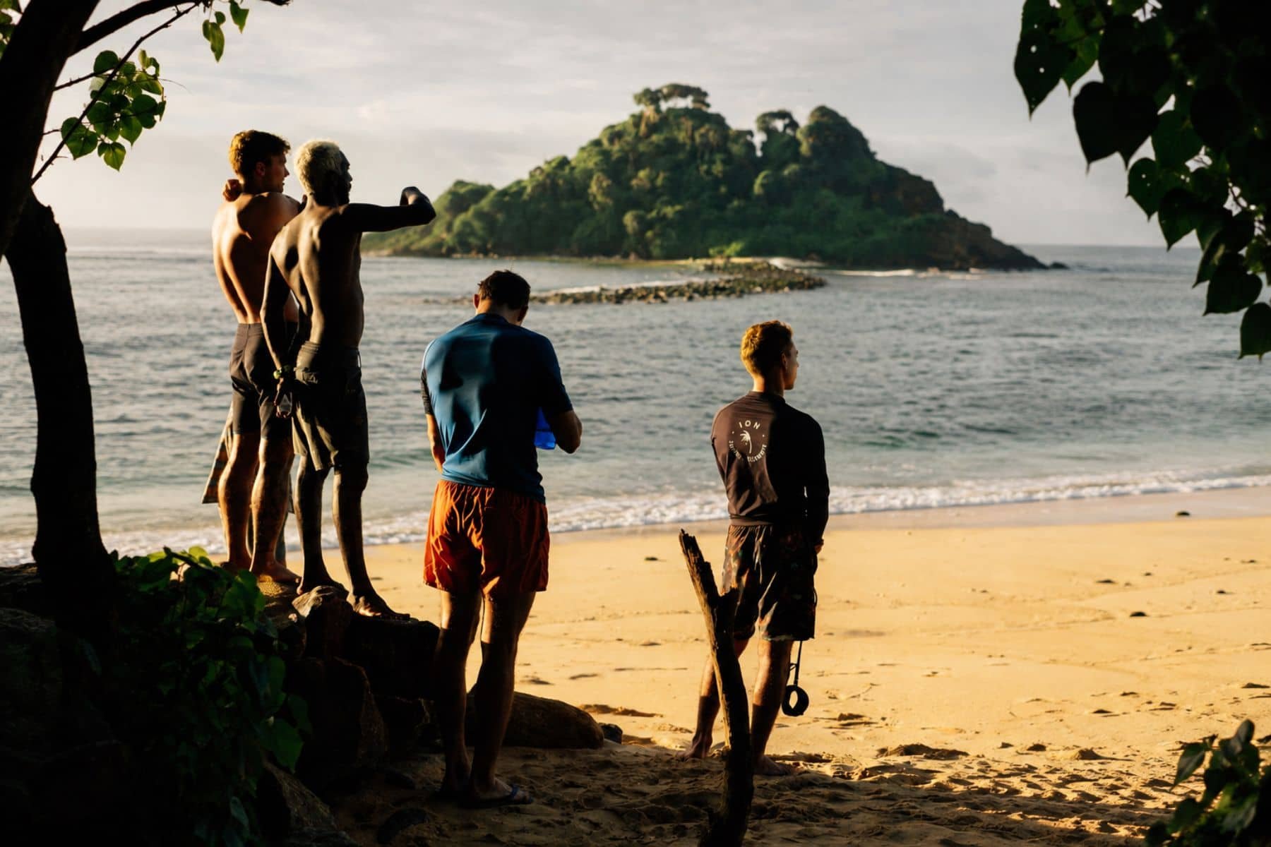 Coach checking the ocean before paddling out at sunrise