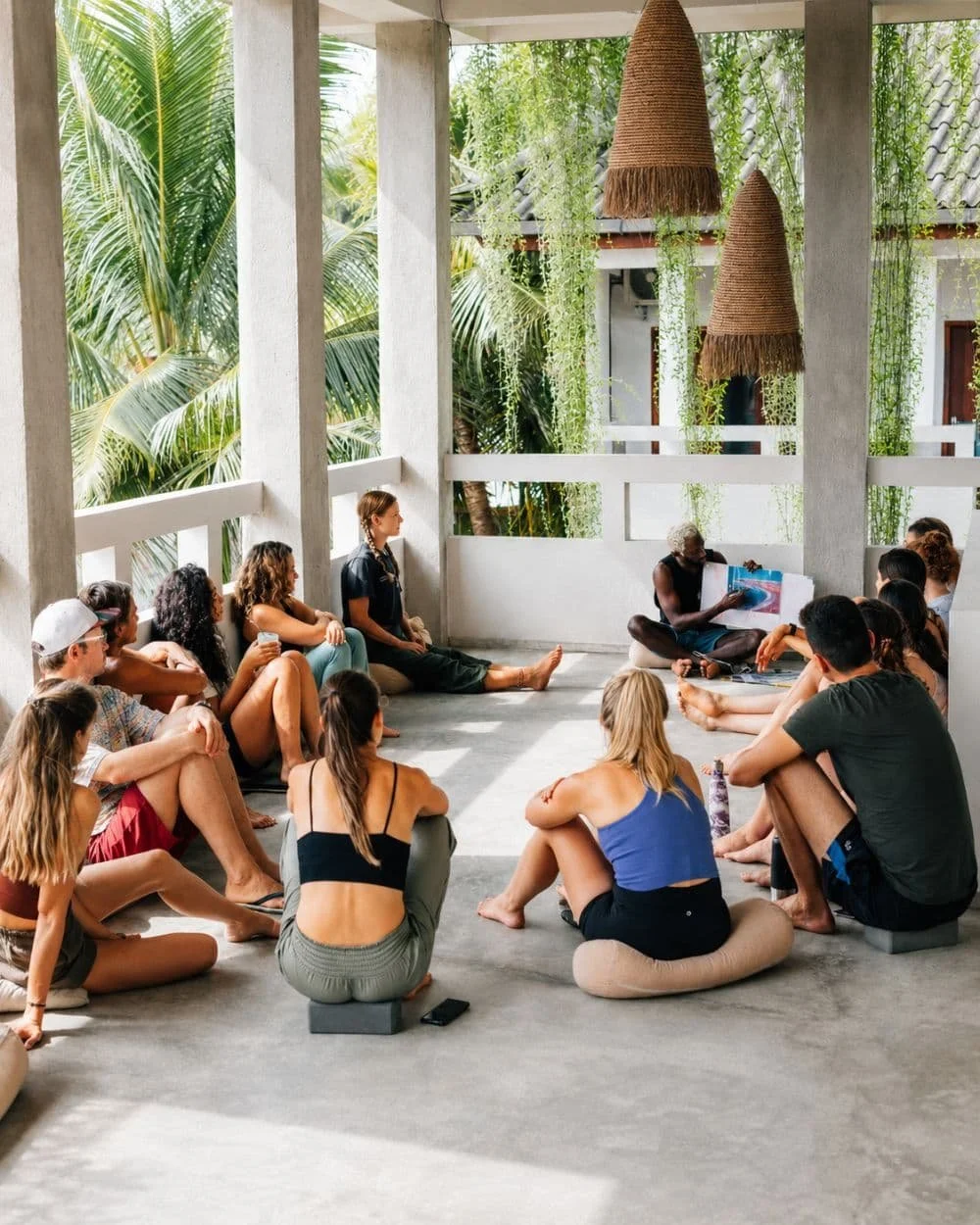 Coach leading a theory session on wave selection and turning technique for intermediate guests
