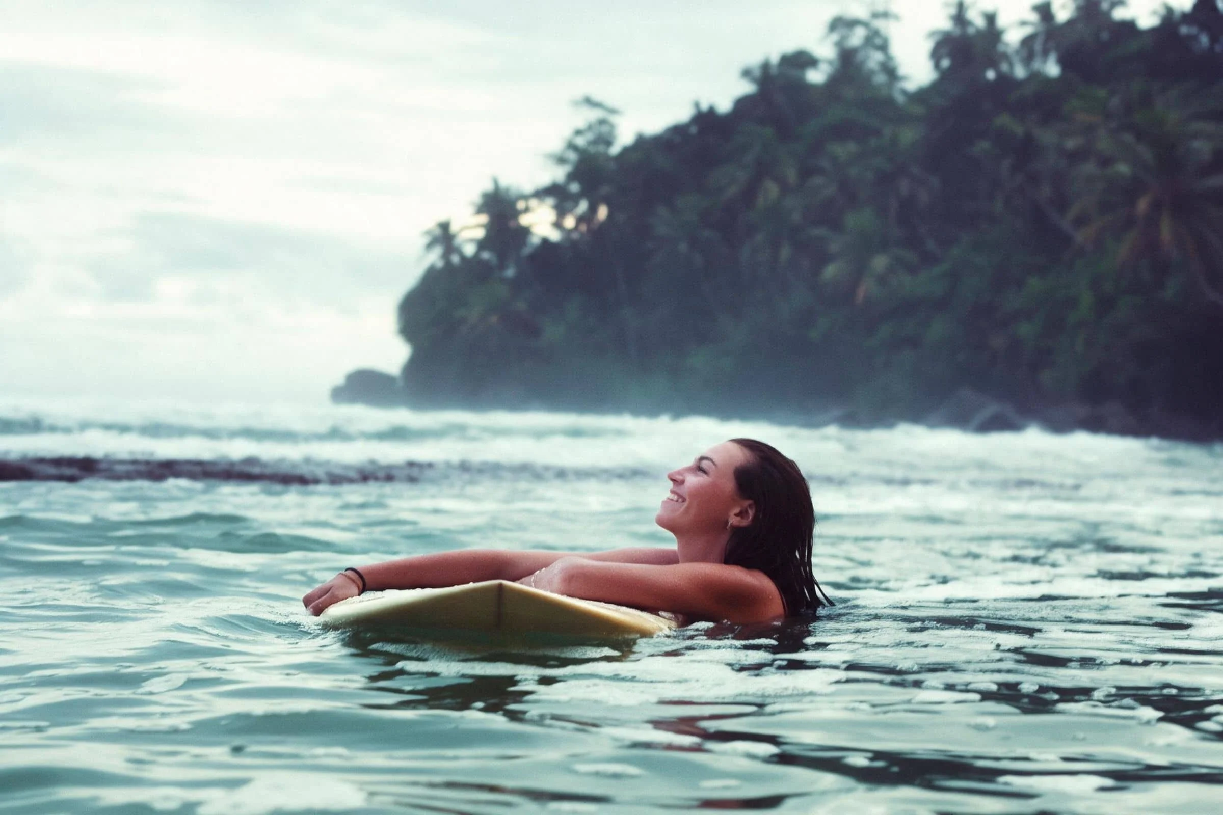 Guest surfing a wave at Layback's Sri Lanka surfing camp in Weligama