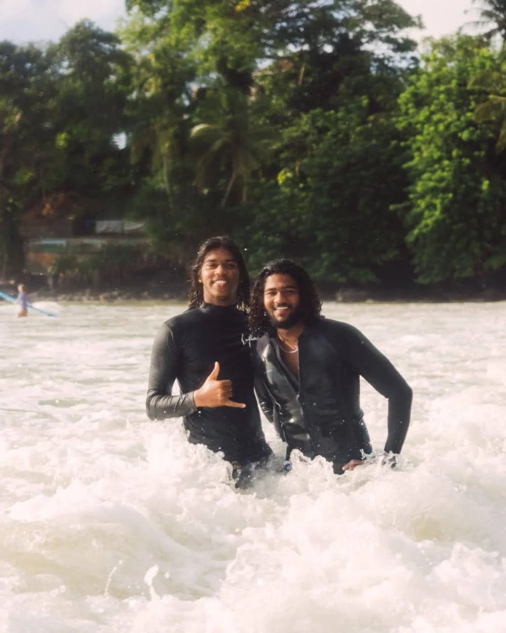 Layback's local surf coaching team on the beach in Weligama, Sri Lanka