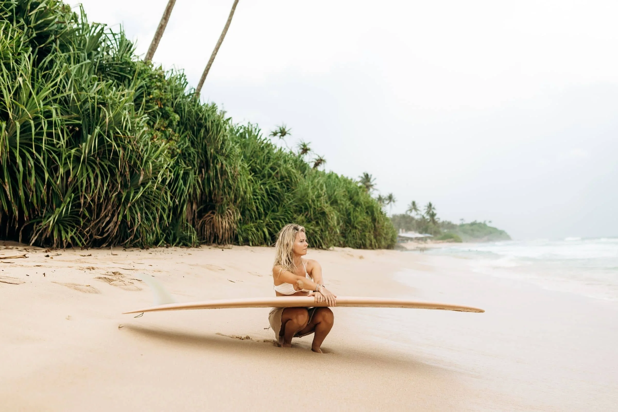 Layback guests and coaches together after a surf session in Weligama