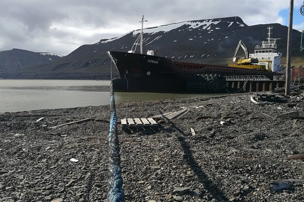 Pole Position Logistics also charters ships in North Norway and Svalbard. In 2018, MV Titran made a few trips to Svalbard bringing bulk shipments with gravel and split stone from Norway and inert dust using in securing mining tunnels from Murmansk. After completing discharging and cleaning the holds, MV Titran loaded around 5500 mt high quality coal for delivery to the metallurgy industry in Europe via Rotterdam. Combining freights is a more sustainable option than sending a vessel empty one way.