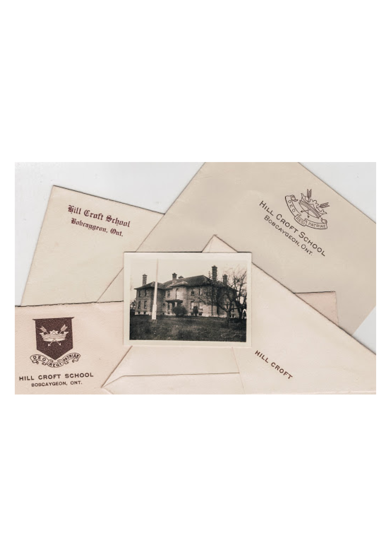 Photo of the Hill Croft School featuring letterheads and envelopes. It’s motto, Deo Regi Patriae translates to ‘For God, King and Country’.