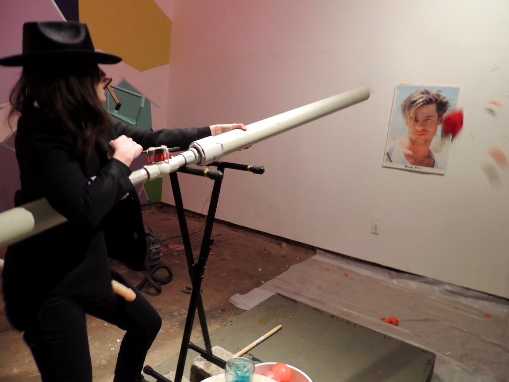 Shooting Tomatoes at Brad Pitt Poster dressed as Bill Hicks wearing a strap on, 2013