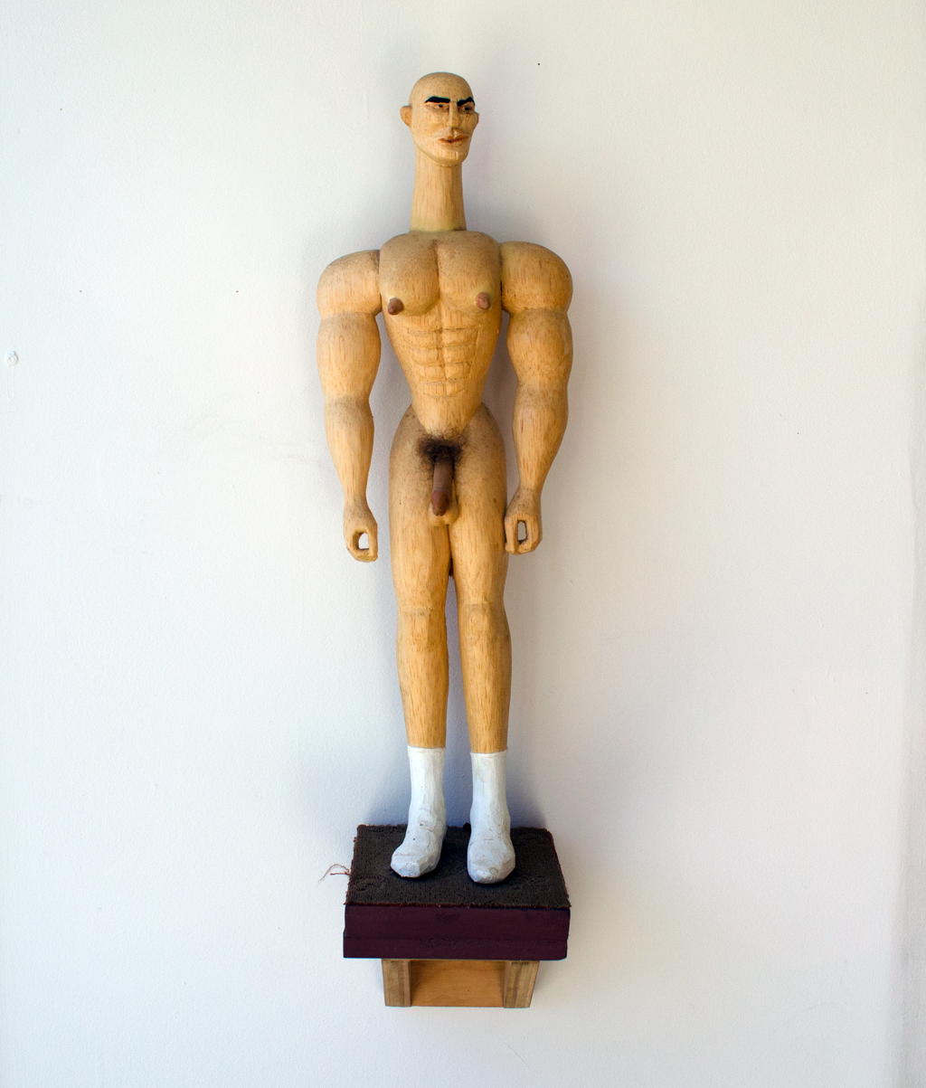 Mike Goodlett, Kourous, 1998, Wood, cloth, synthetic hair, 14 x 4 inches