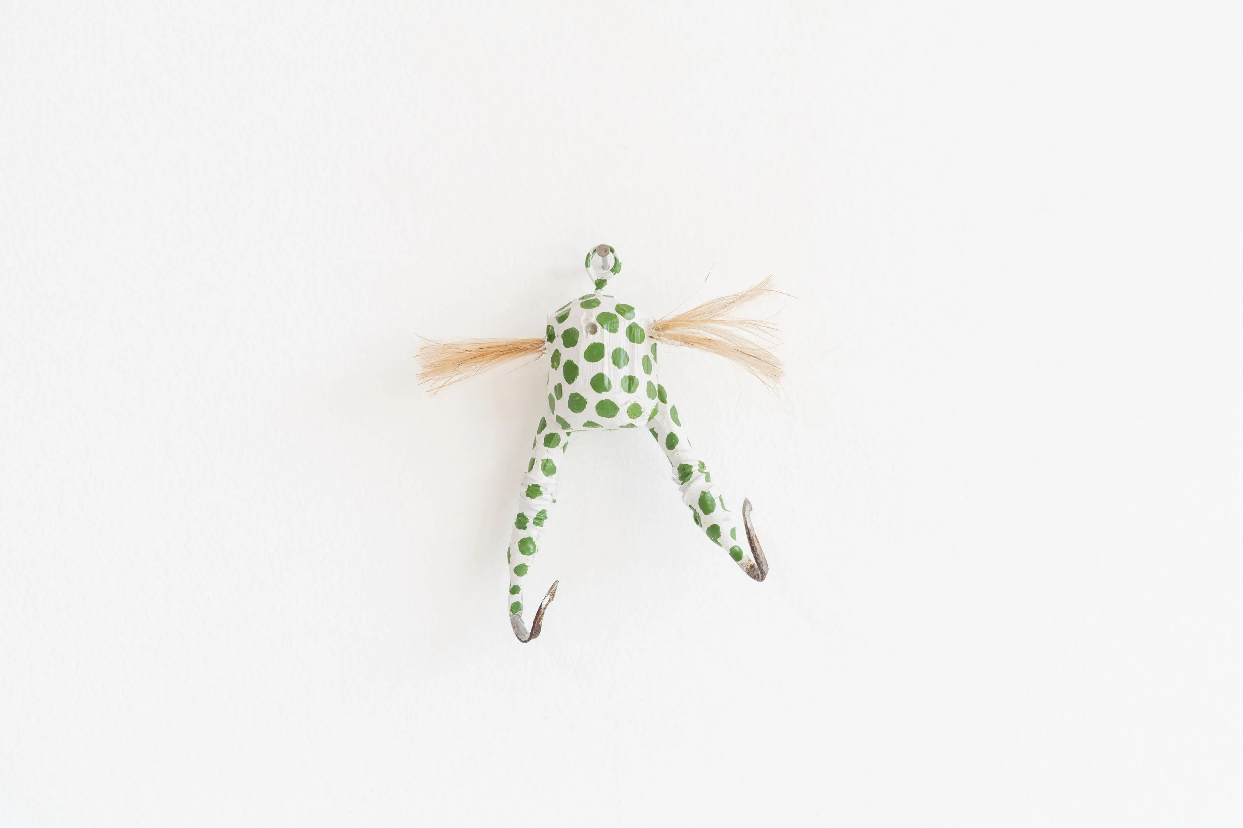 Eric Oglander, Frog lure, 2025, pine, street sweeper bristles, dog fur, wire, epoxy, enamel paint, 3 ¼ x 3 x 1 inches