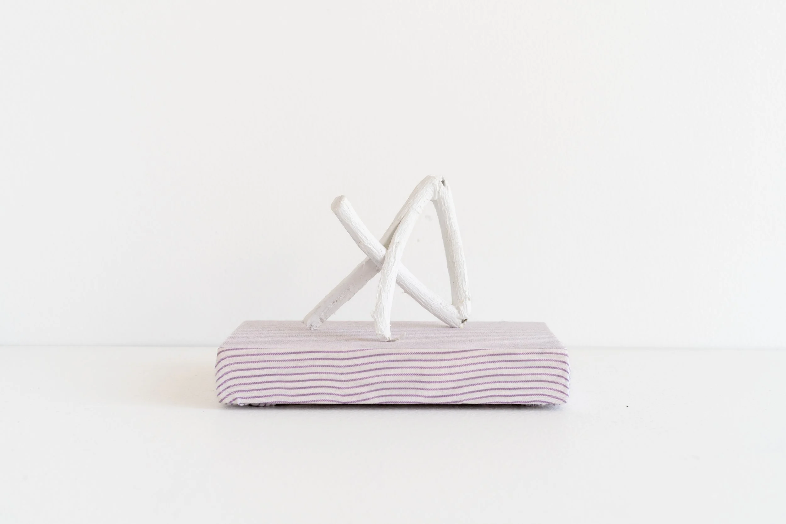 Eric Oglander, Broken twice, split, nailed, 2023, poplar, mulberry, nail, fabric from button down shirt, acrylic paint, 5 x 3 ½ x 3 ⅝ inches