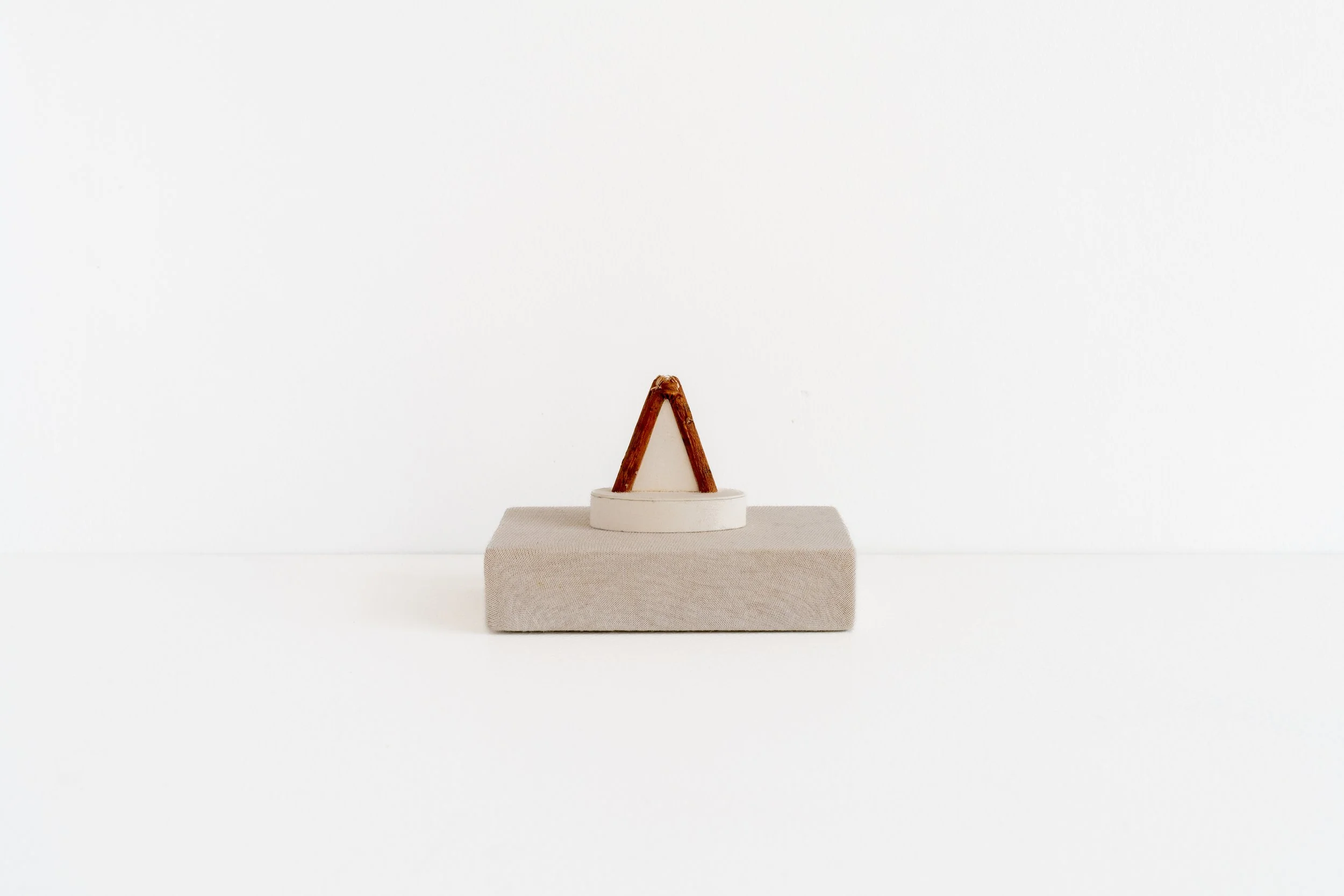 Eric Oglander, Split mulberry filled with paper, 2023, poplar, mulberry, paper, fabric from t-shirt, 4 ¾ x 3 ¼ x 3 ⅛ inches