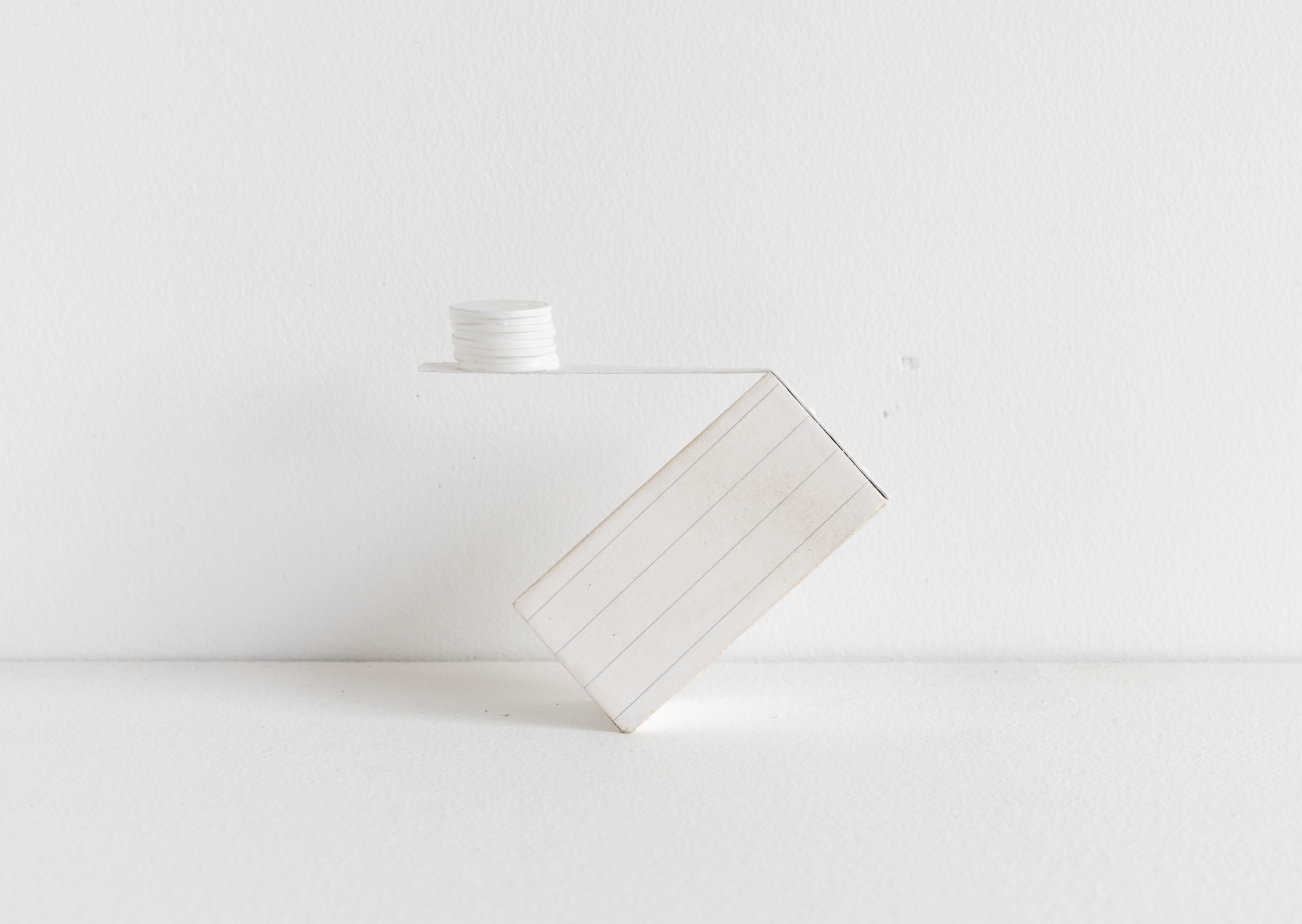 Eric Oglander, Rule of balance, 2025, poplar, copper, pennies, paper, enamel paint, 3 ½ x 1 ⅛ x 3 ⅛ inches