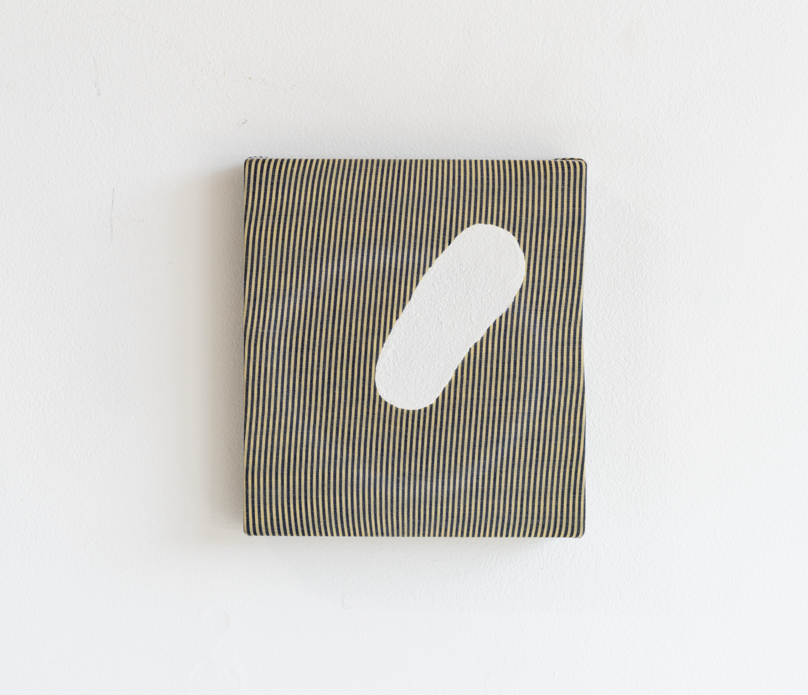 Eric Oglander, Orb, 2025, plywood, fabric from button down shirt, enamel paint, linseed oil, 5 ½ x 6 inches