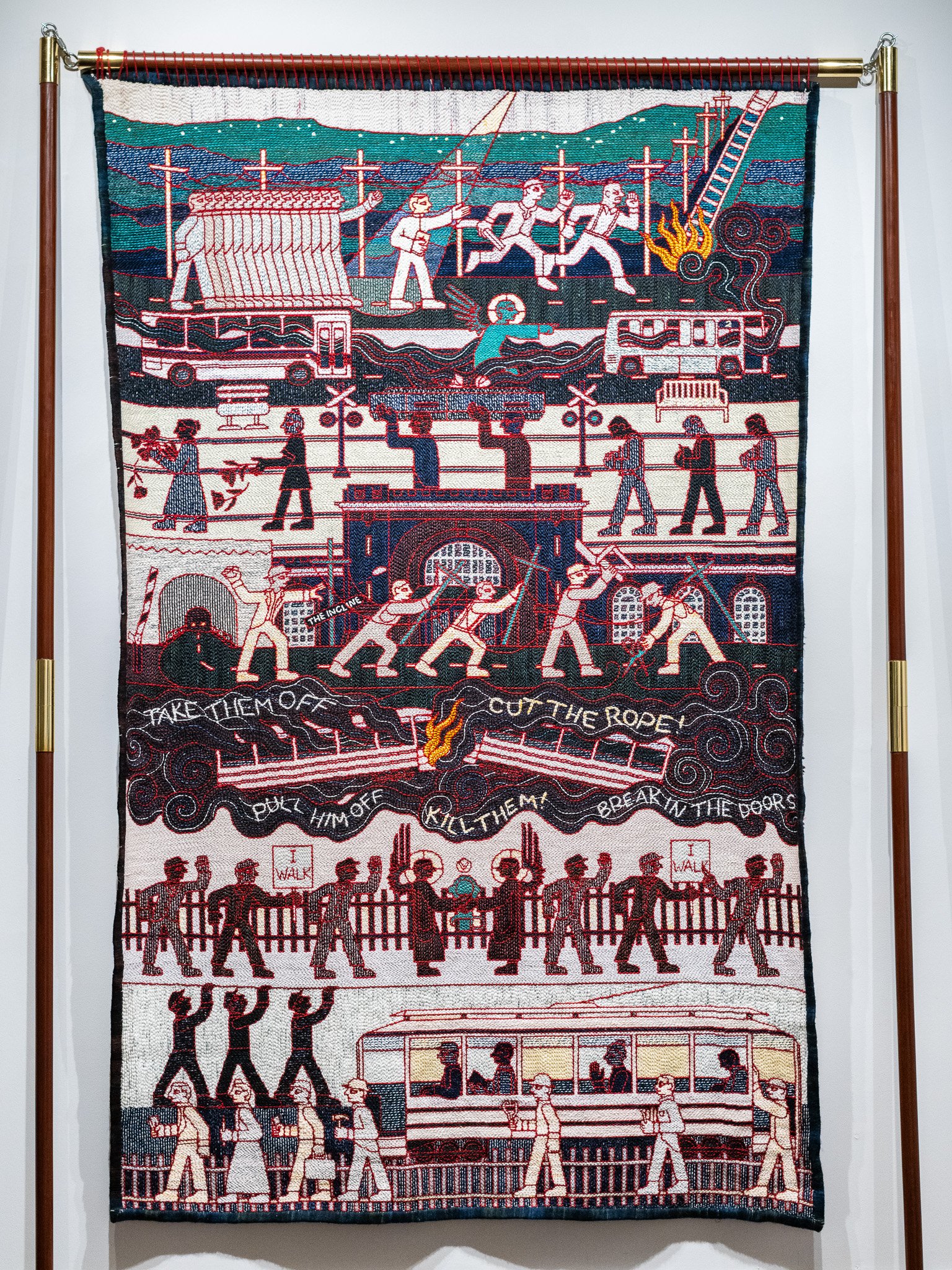 Tabitha Arnold, I Walk , 2025. Punch needle embroidered wool and cotton yarn on linen cloth, 48 x 7 7 inches.
