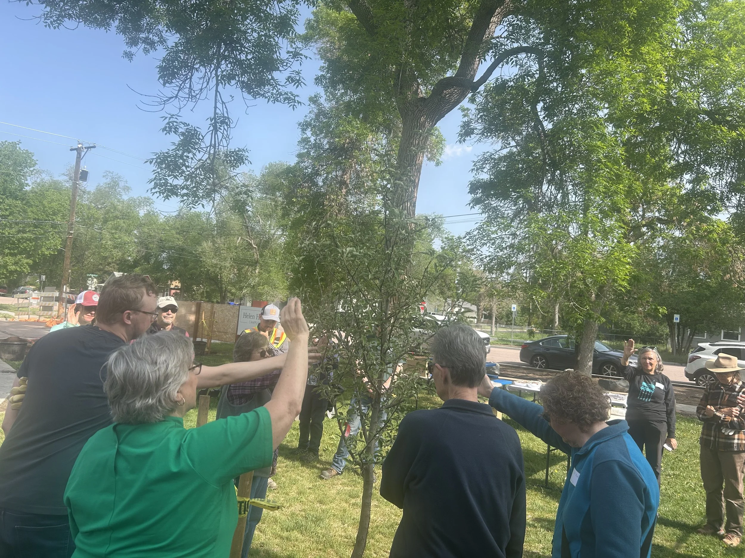 Pastor of First Congregational Church offers a blessing for the trees planted at Helen Hunt Family Project