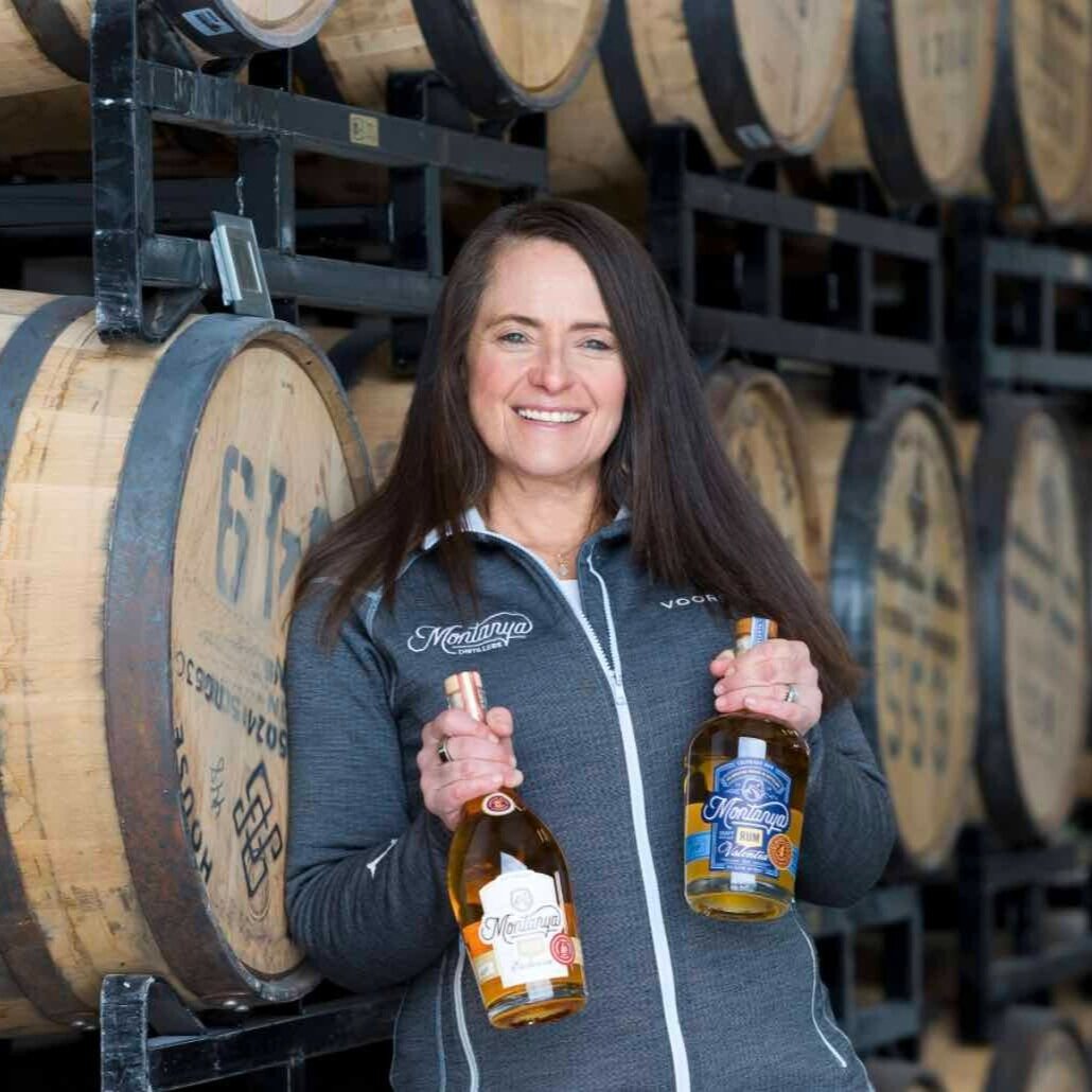 Karen Hoskin holds Montanya Rum in the barrel house.