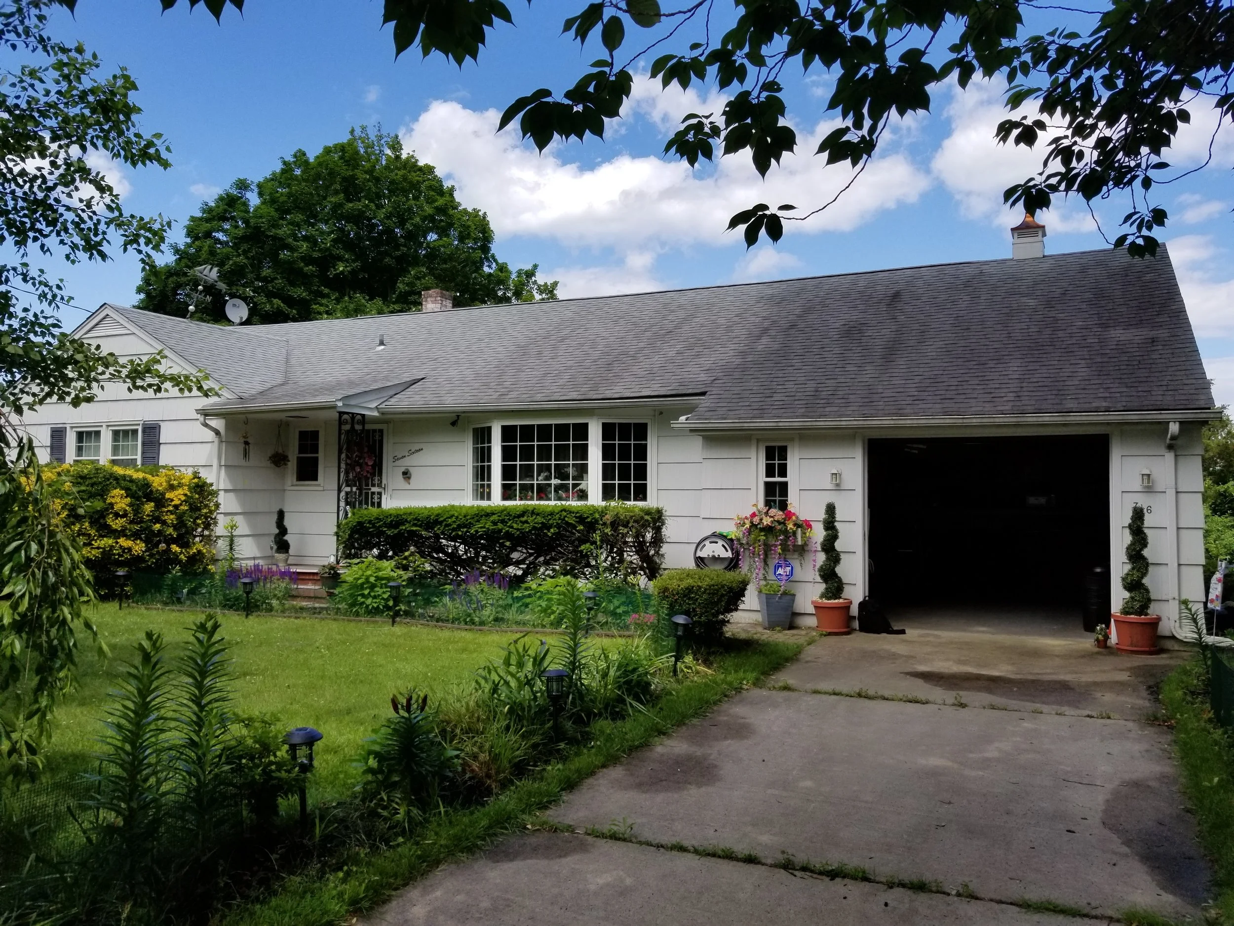 PHOTO OF PRE-RENOVATED FRONT OF HOME