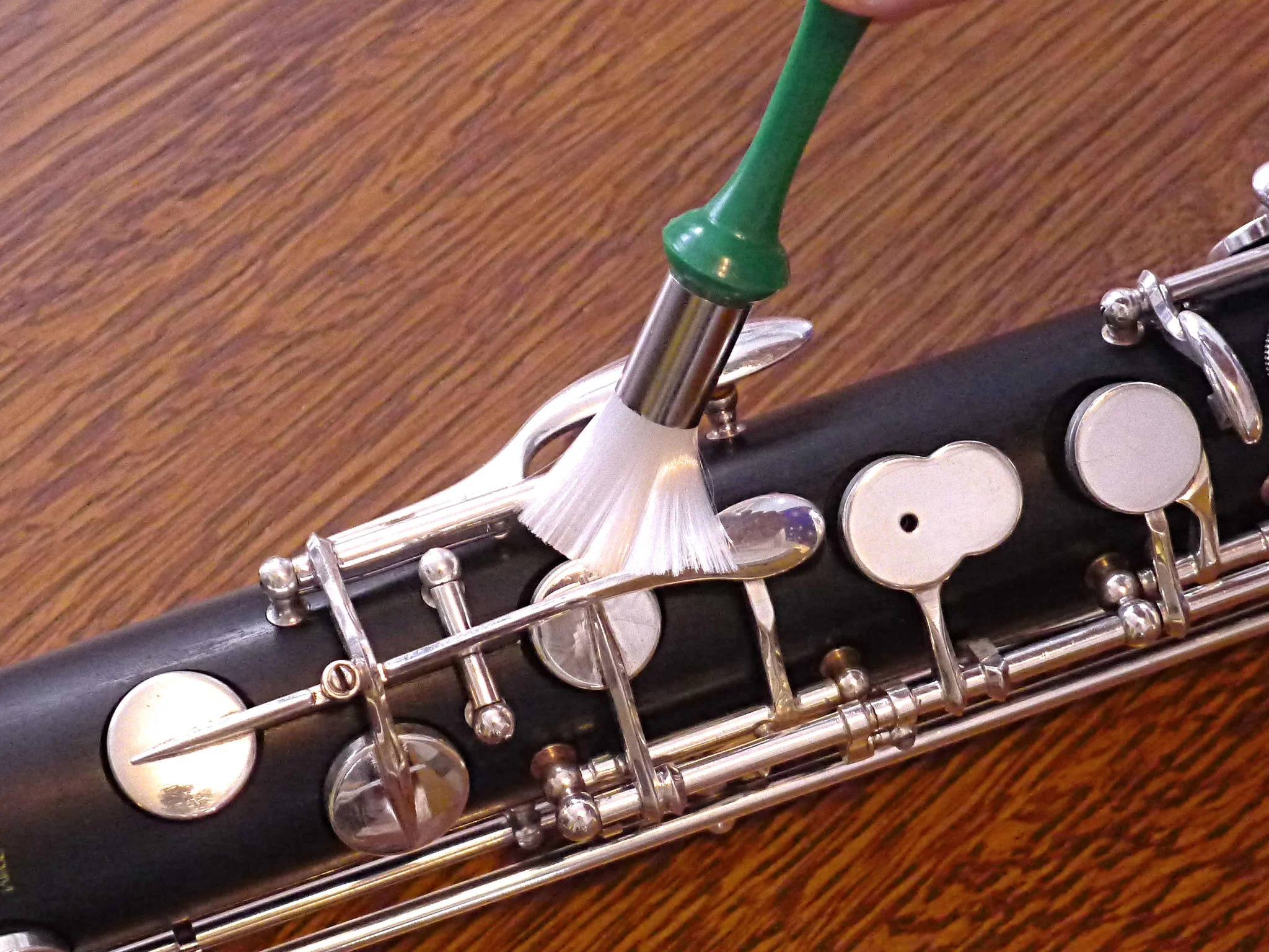 Nylon brush cleaning a bass clarinet