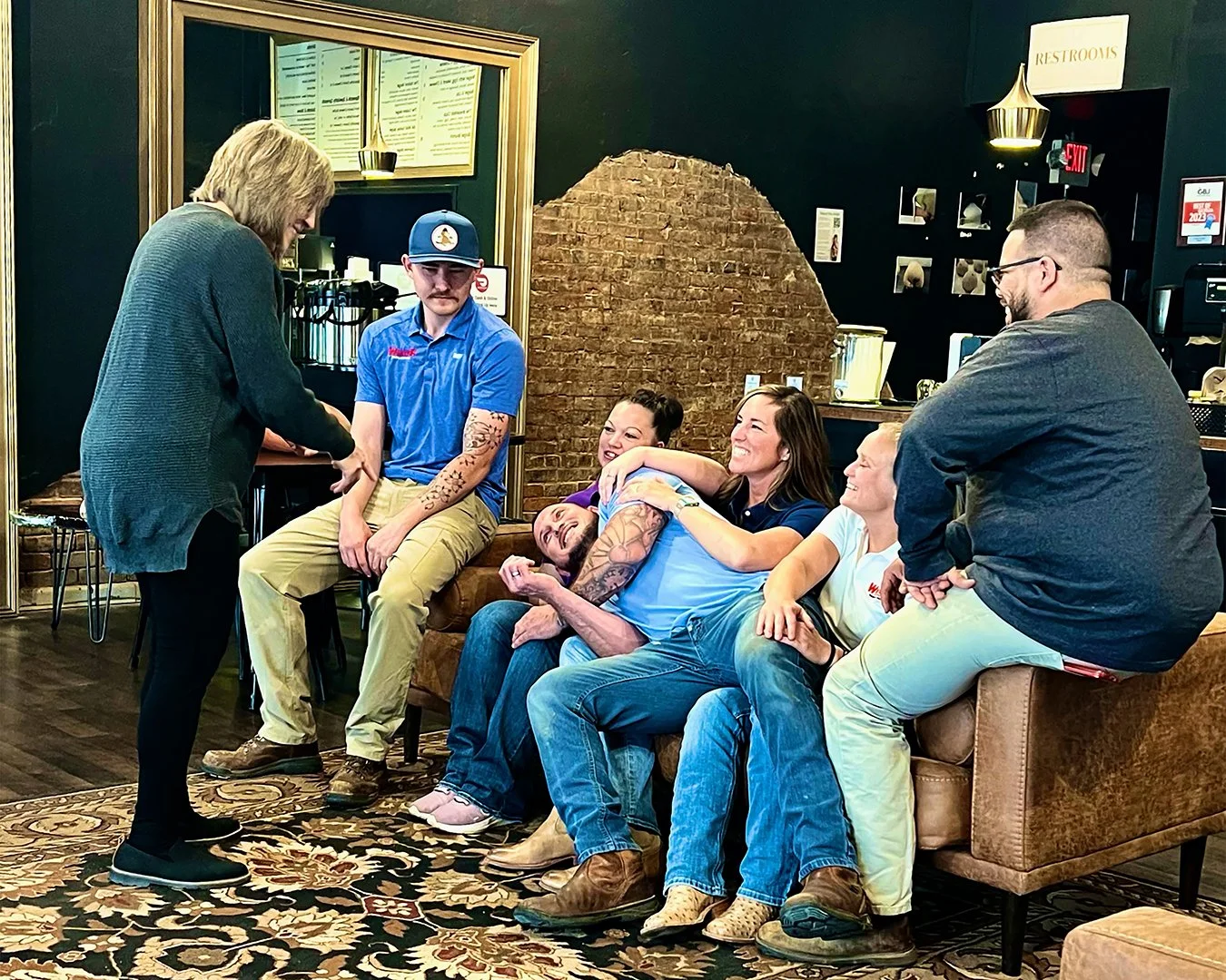 Behind the scenes team photo in coffee shop