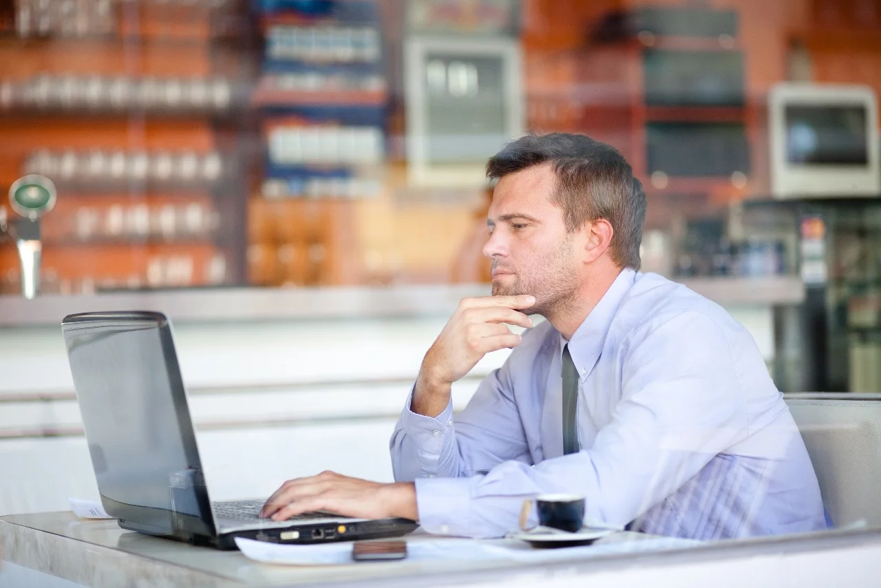 pensive businessman in a cafe.jpg