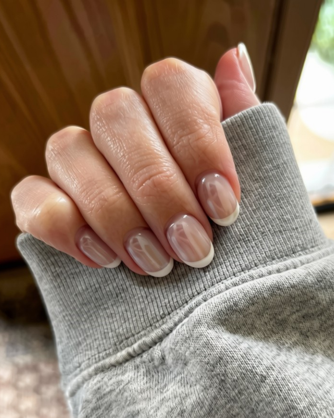 Image featuring the TikTok beauty trend of Chrome French Tips.