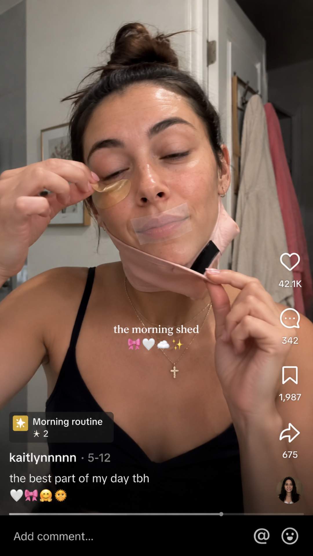 Woman doing TikTok beauty trend of Morning Shed in the mirror.