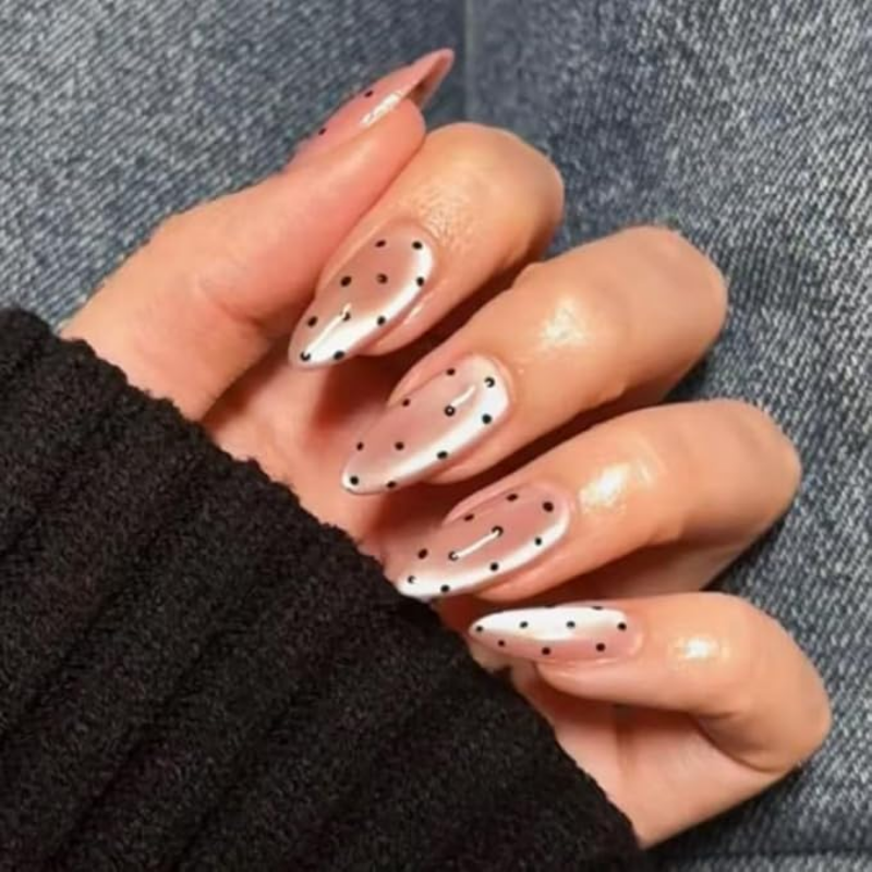 Fall chrome nail idea featuring sheer chrome with black dots