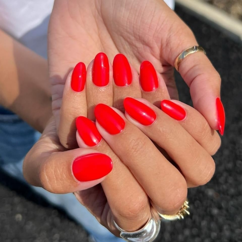 Tomato red nails that make your skin look more tan and enhance a sun-kissed glow.
