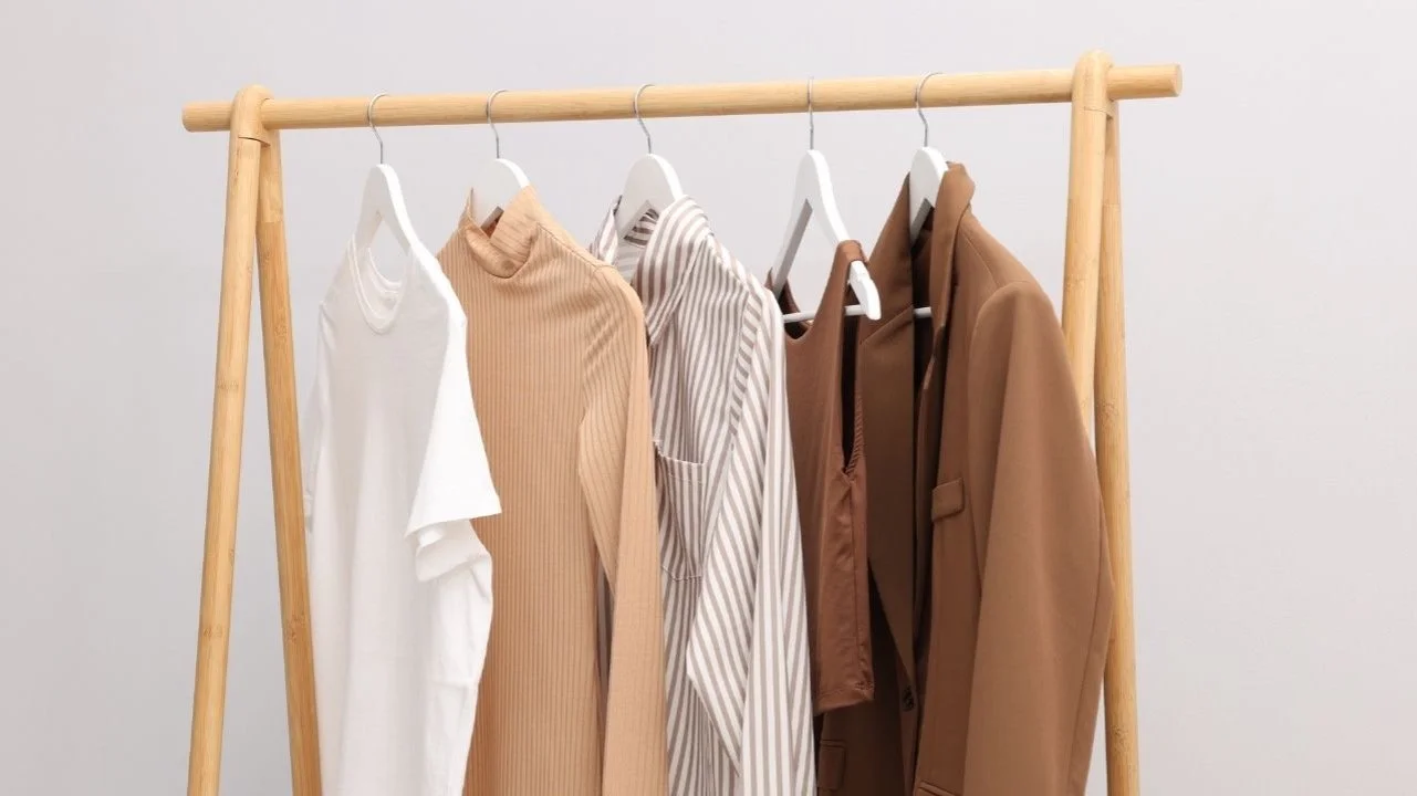 clothing rack with neutral clothes