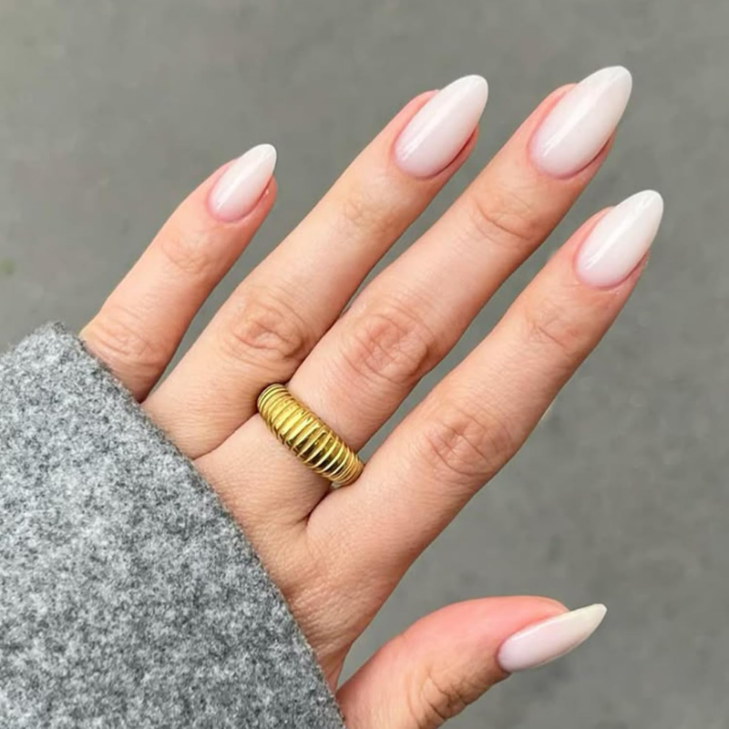 Milky white nails that make your skin look more tan and enhance a sun-kissed glow.