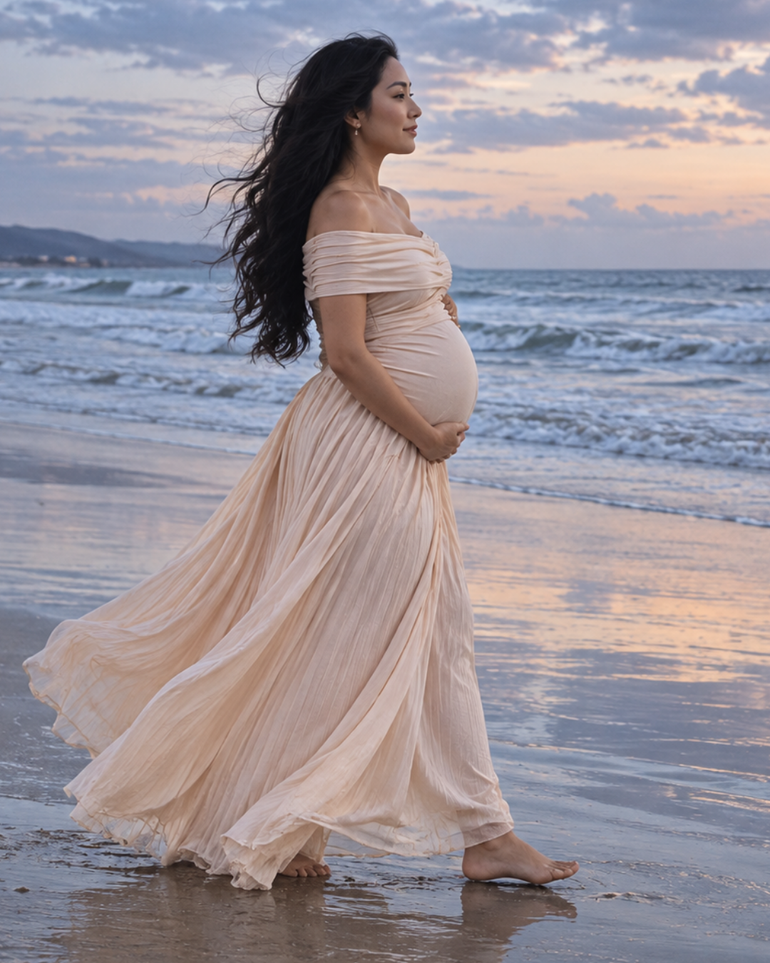Blush pink maternity gown at the beach