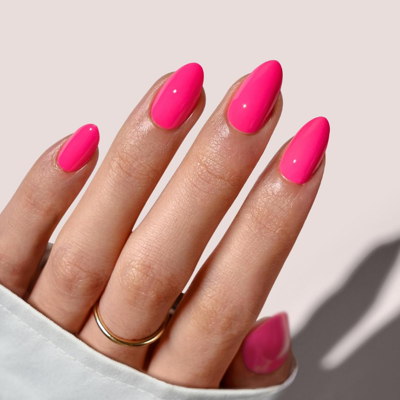 Hot pink nails that make your skin look more tan and enhance a sun-kissed glow.